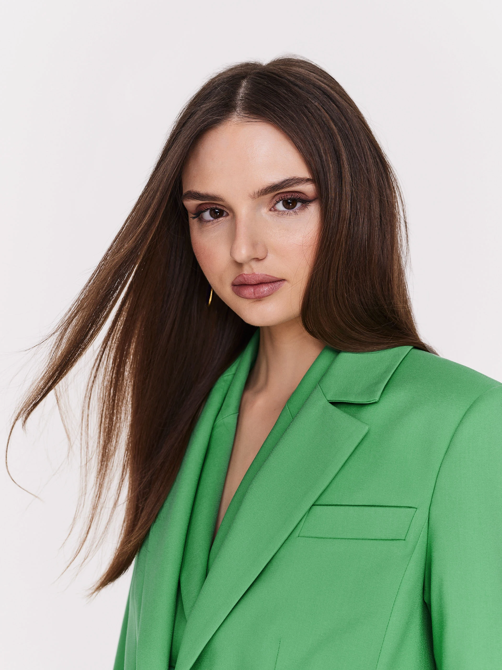 Classic green jacket with a single button closure