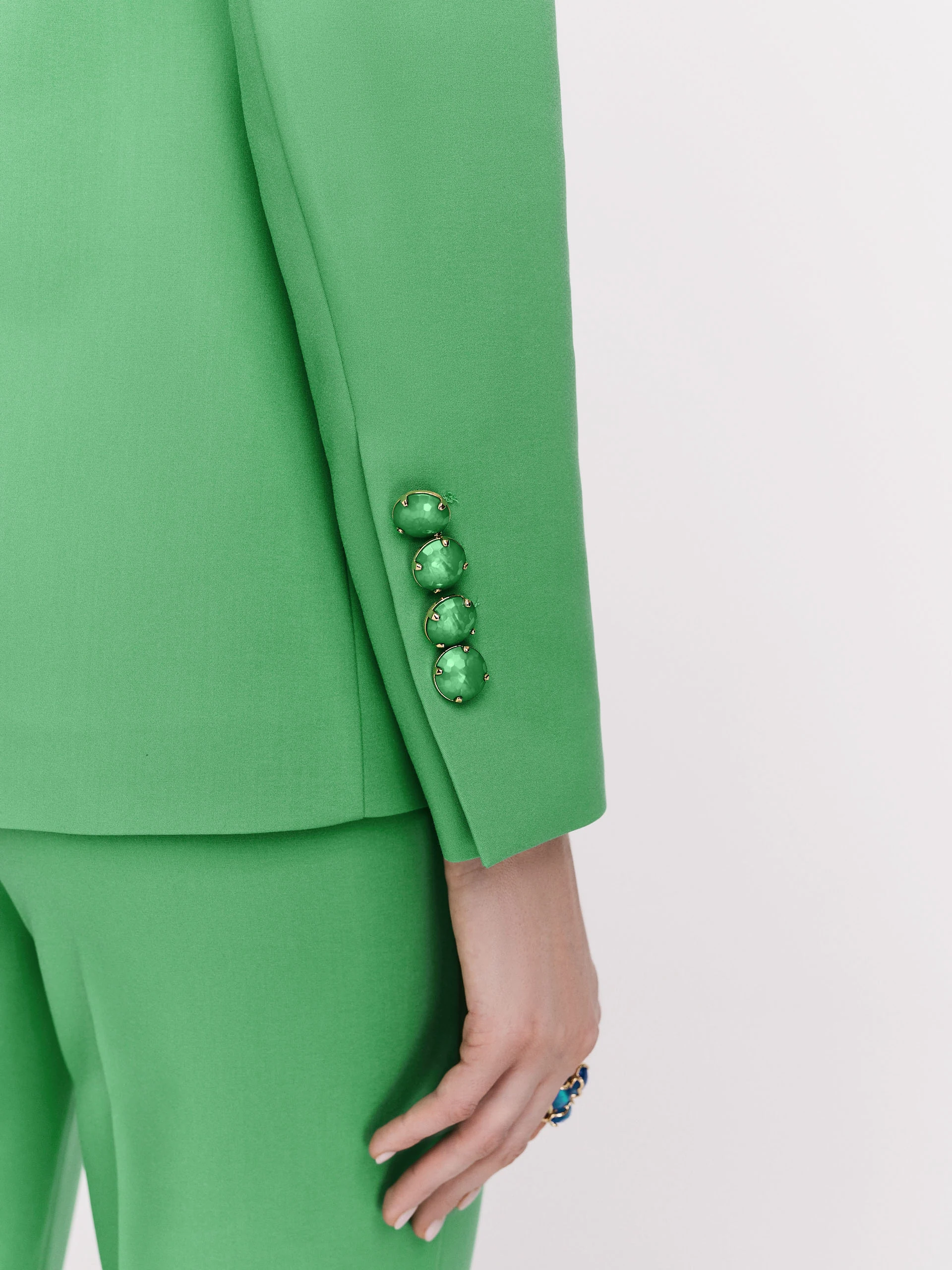 Classic green jacket with a single button closure