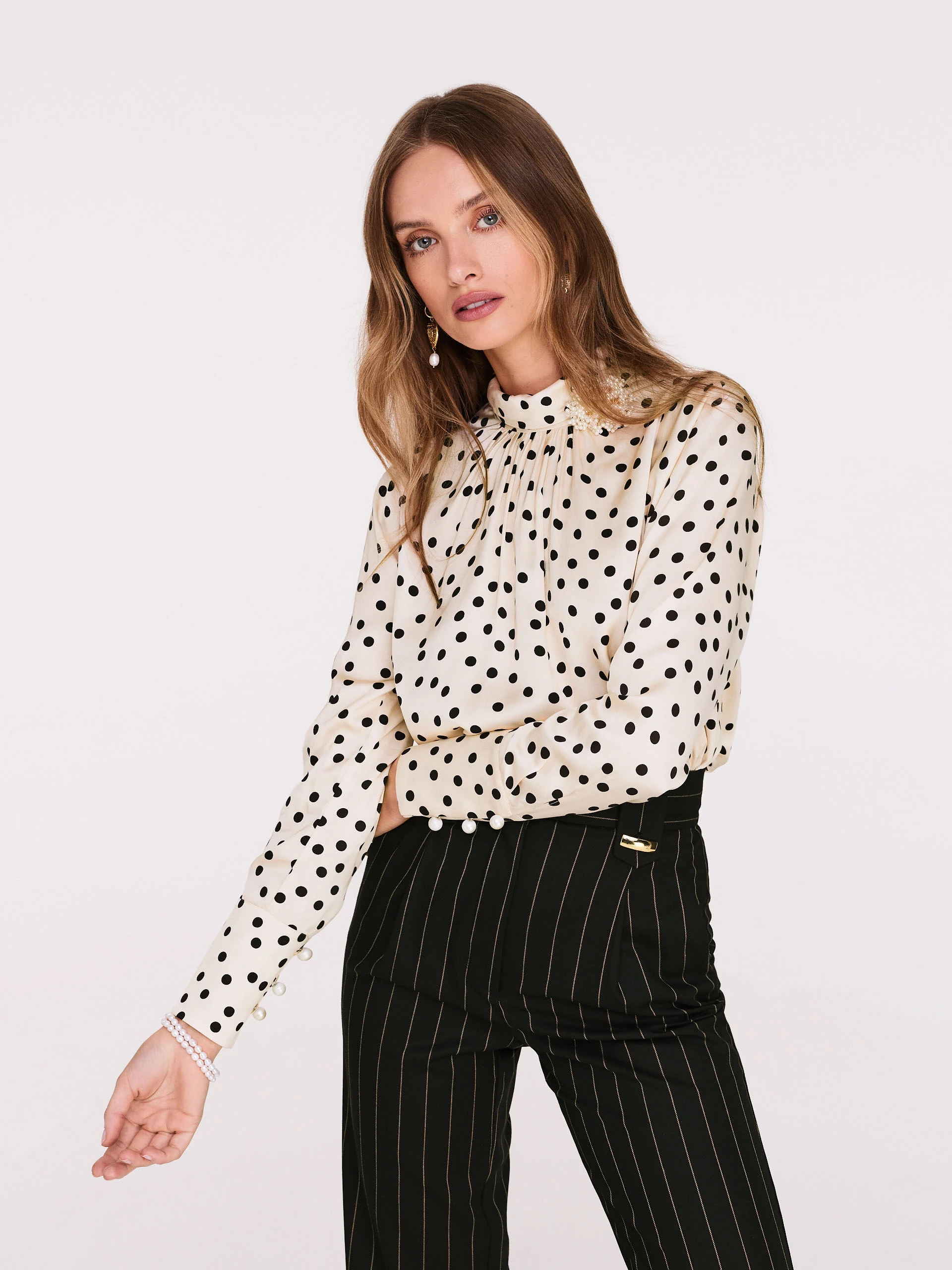 Cream pea blouse with pearl brooch