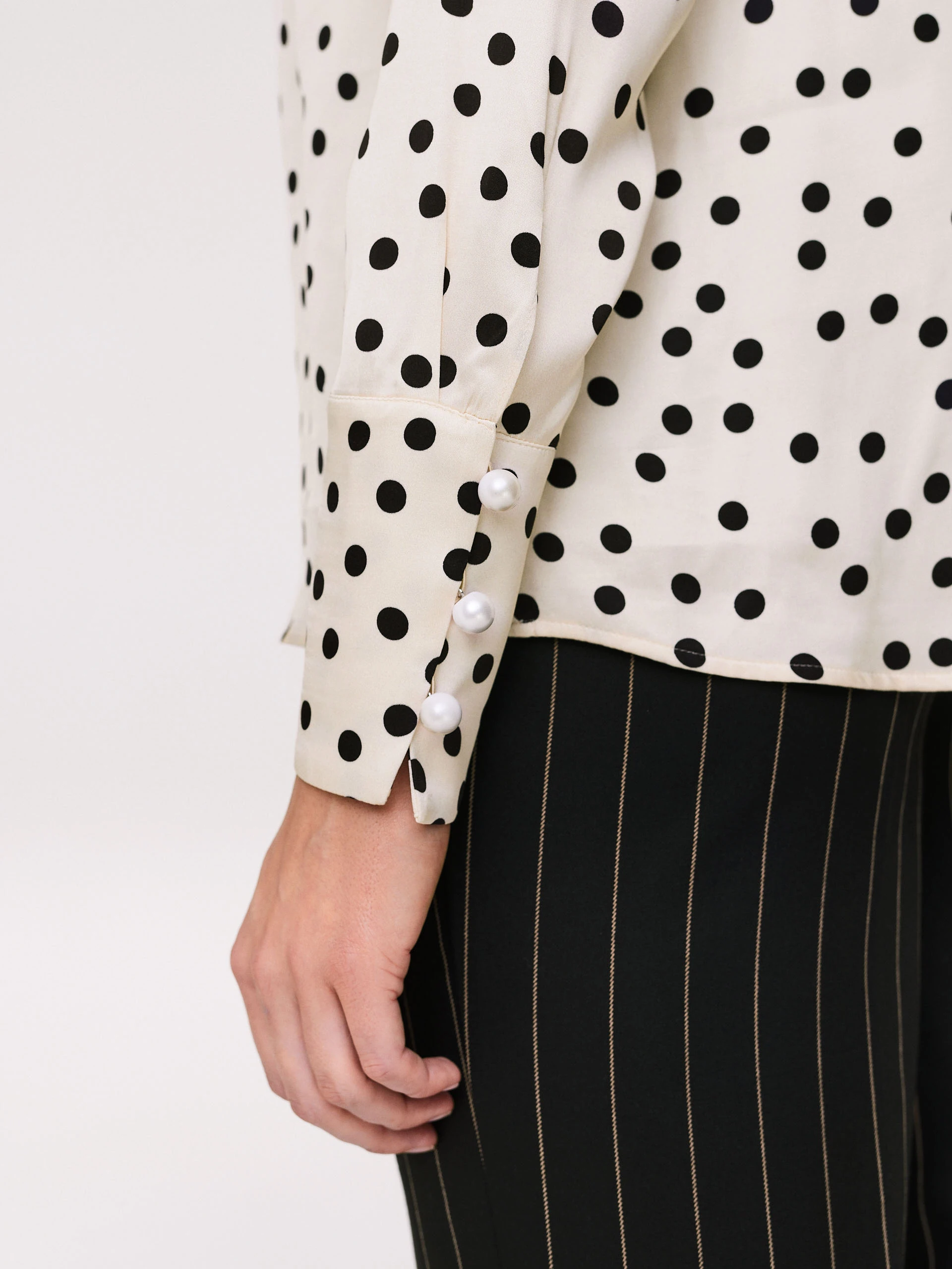 Cream pea blouse with pearl brooch