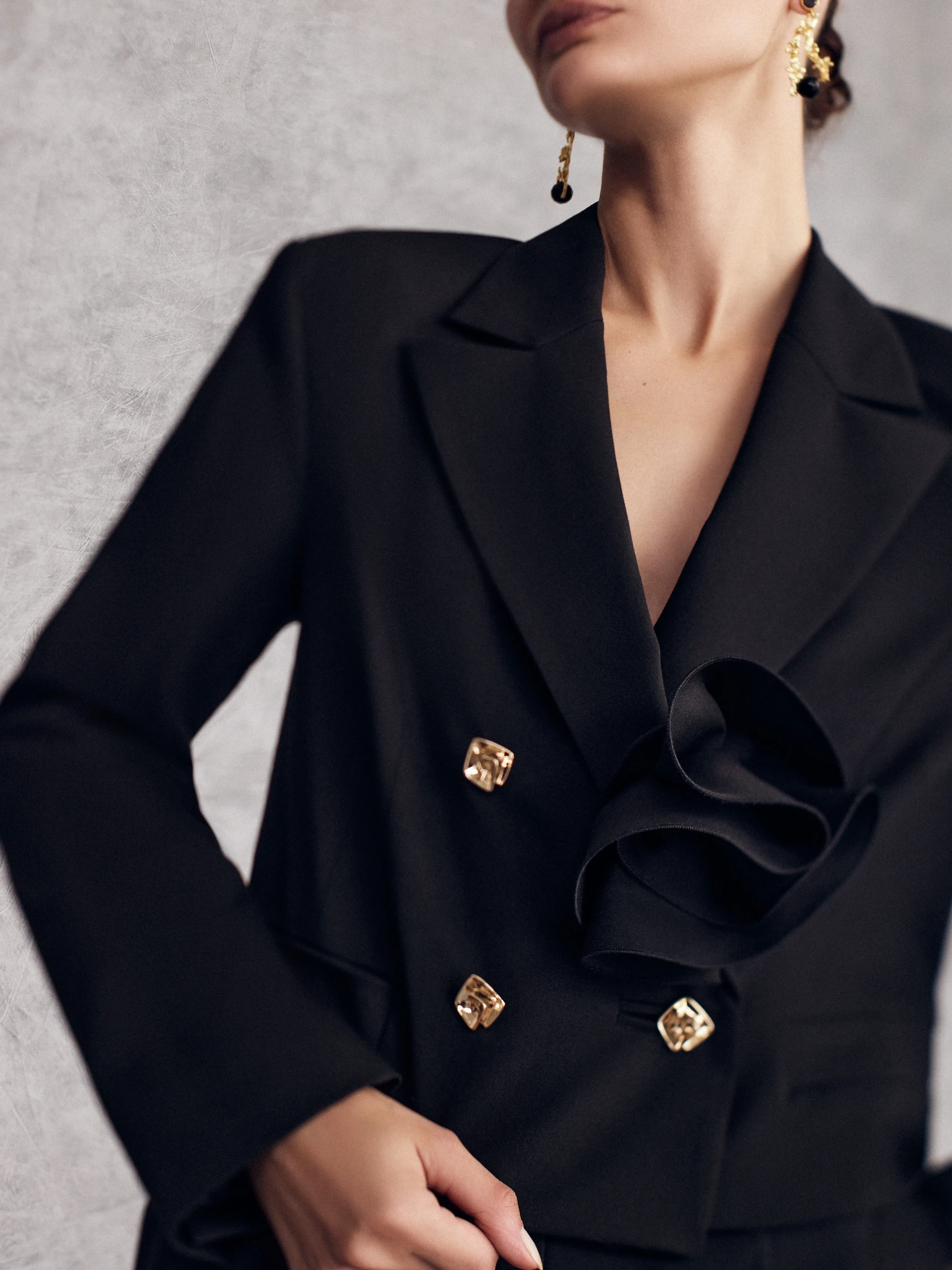 Short black jacket with decorative buttons