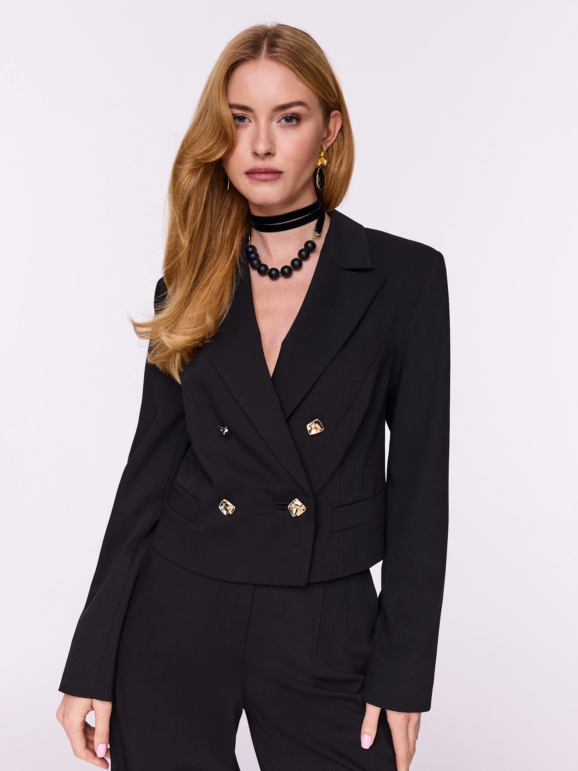 Short black jacket with decorative buttons