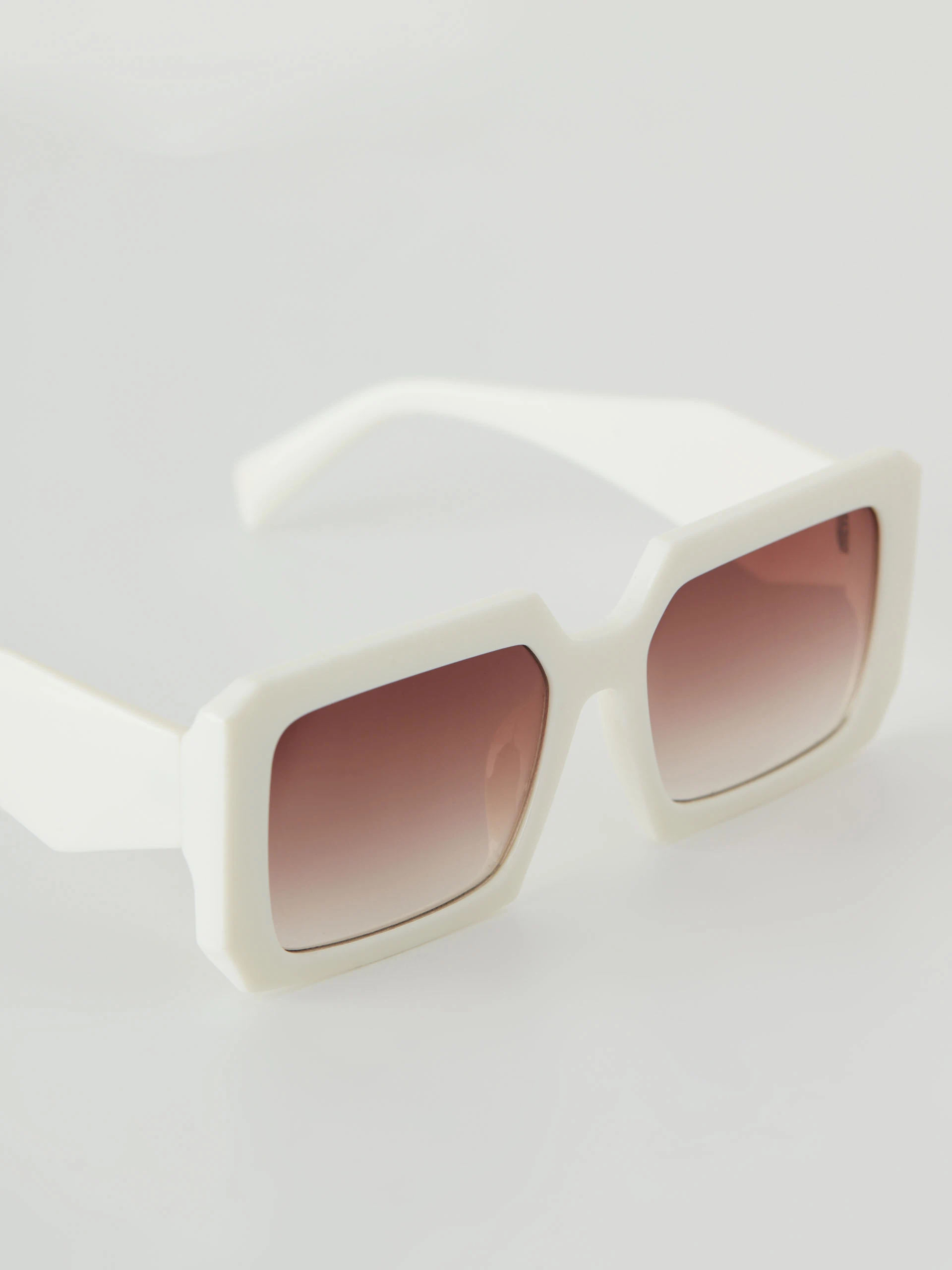 Cream sunglasses with rectangular frames