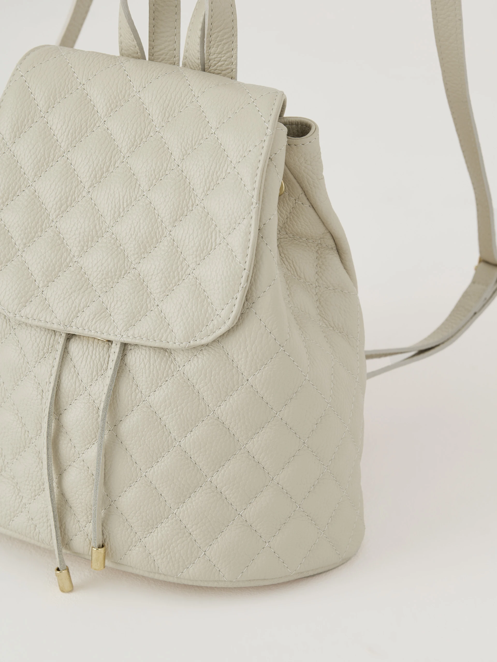 Cream quilted leather backpack