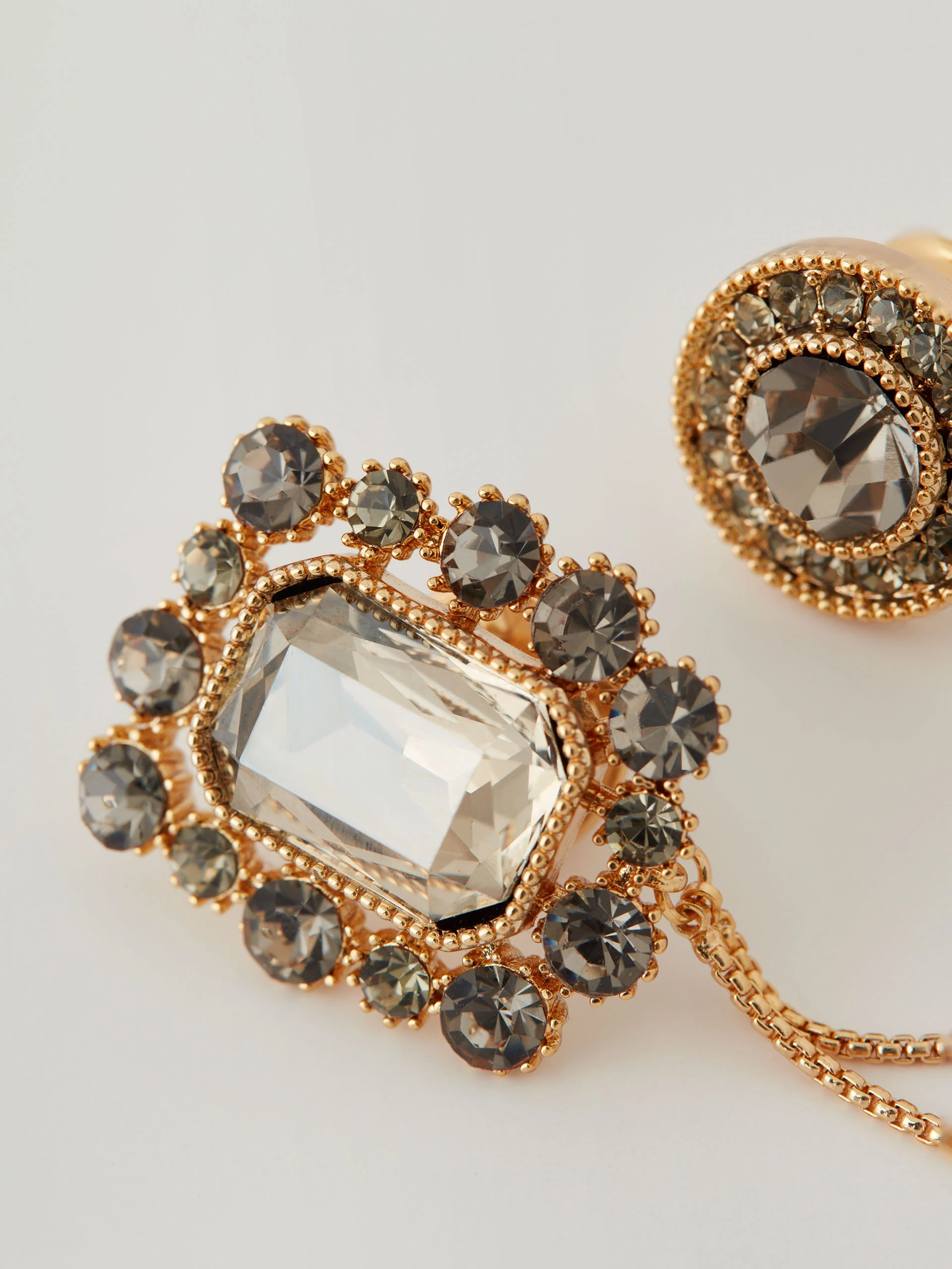 Brooch with jewelry pins connected by a chain