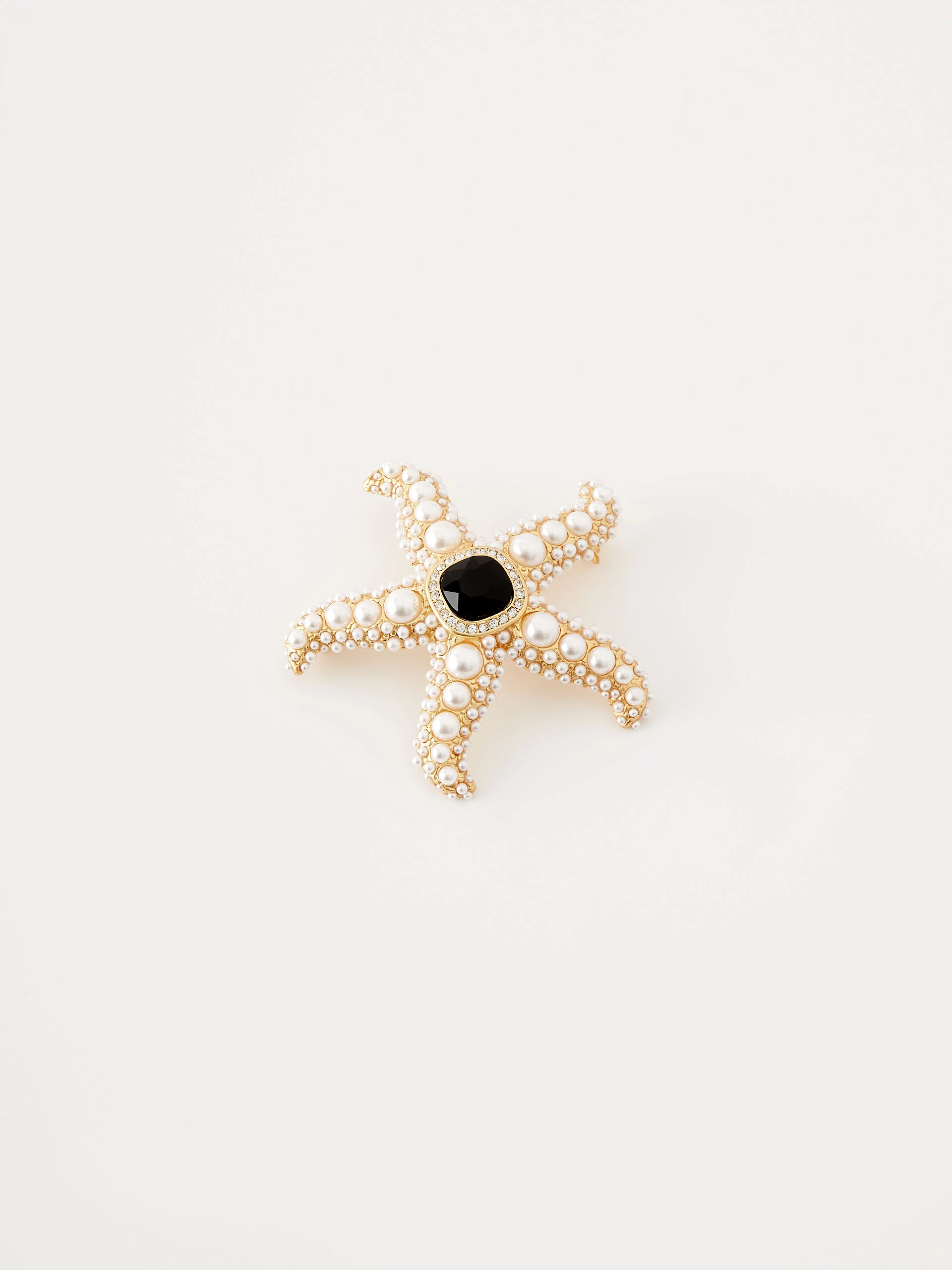Starfish-shaped brooch with pearls