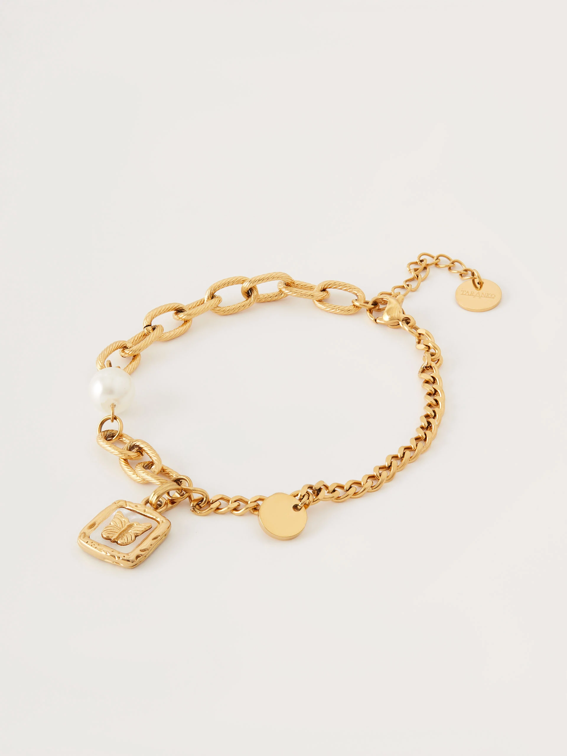 Bracelet with pearl and butterfly pendant