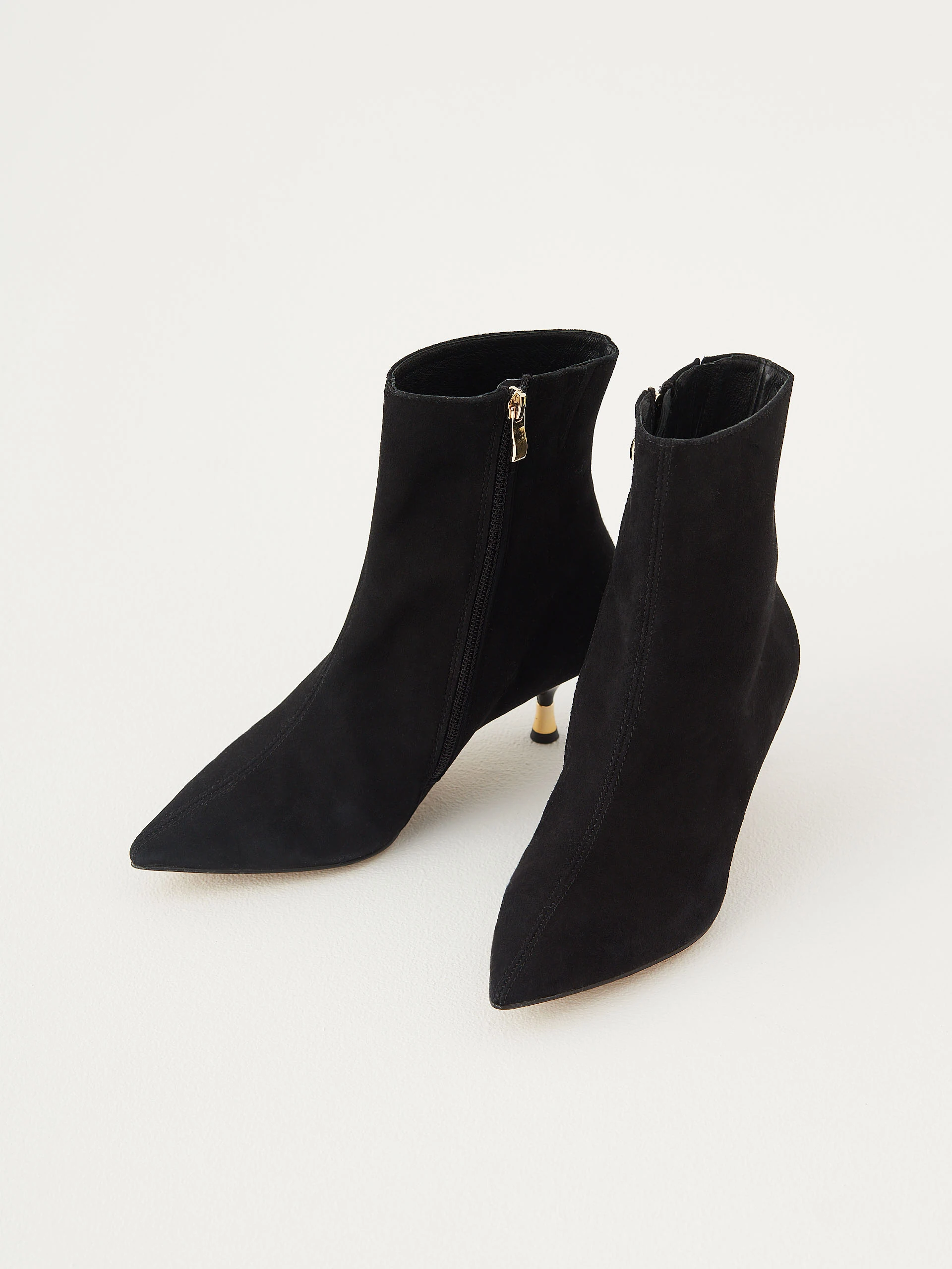 Black suede boots with gold elements