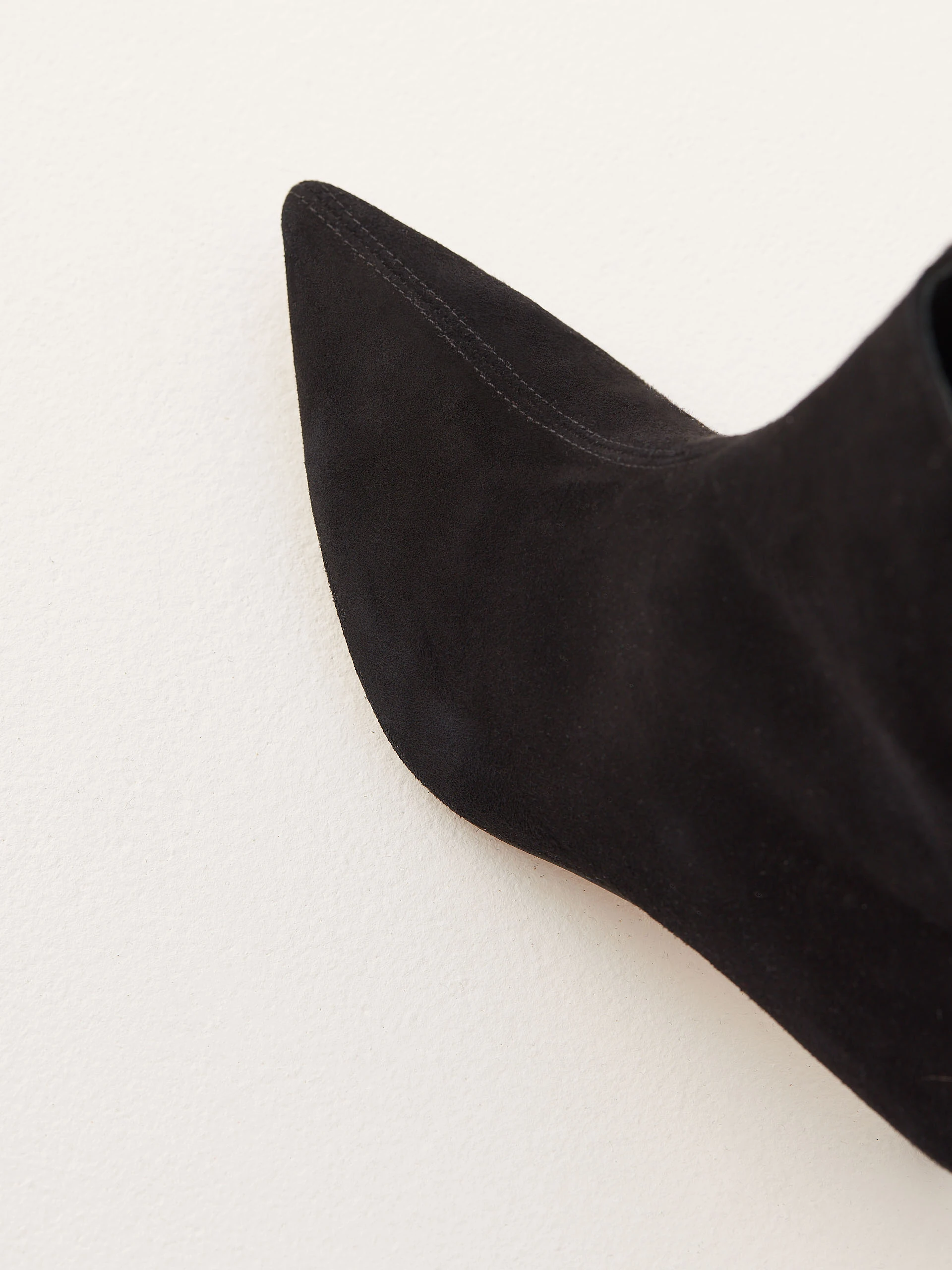 Black suede boots with gold elements