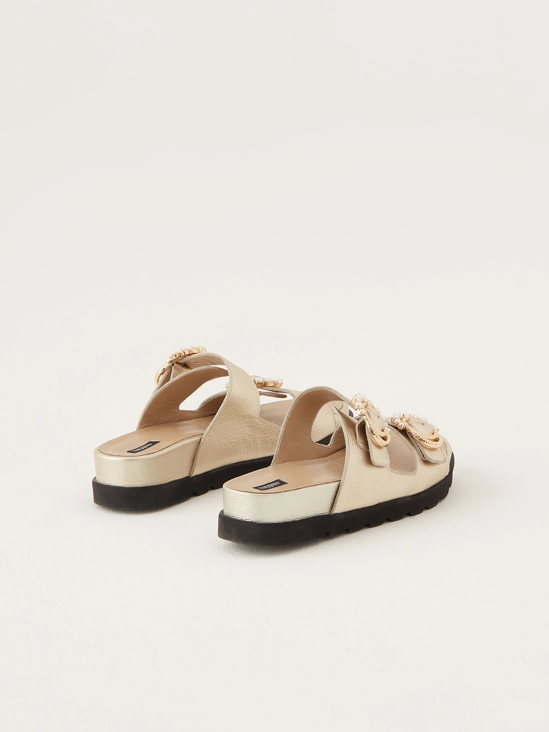 Flip-flops with decorative buckles in gold color