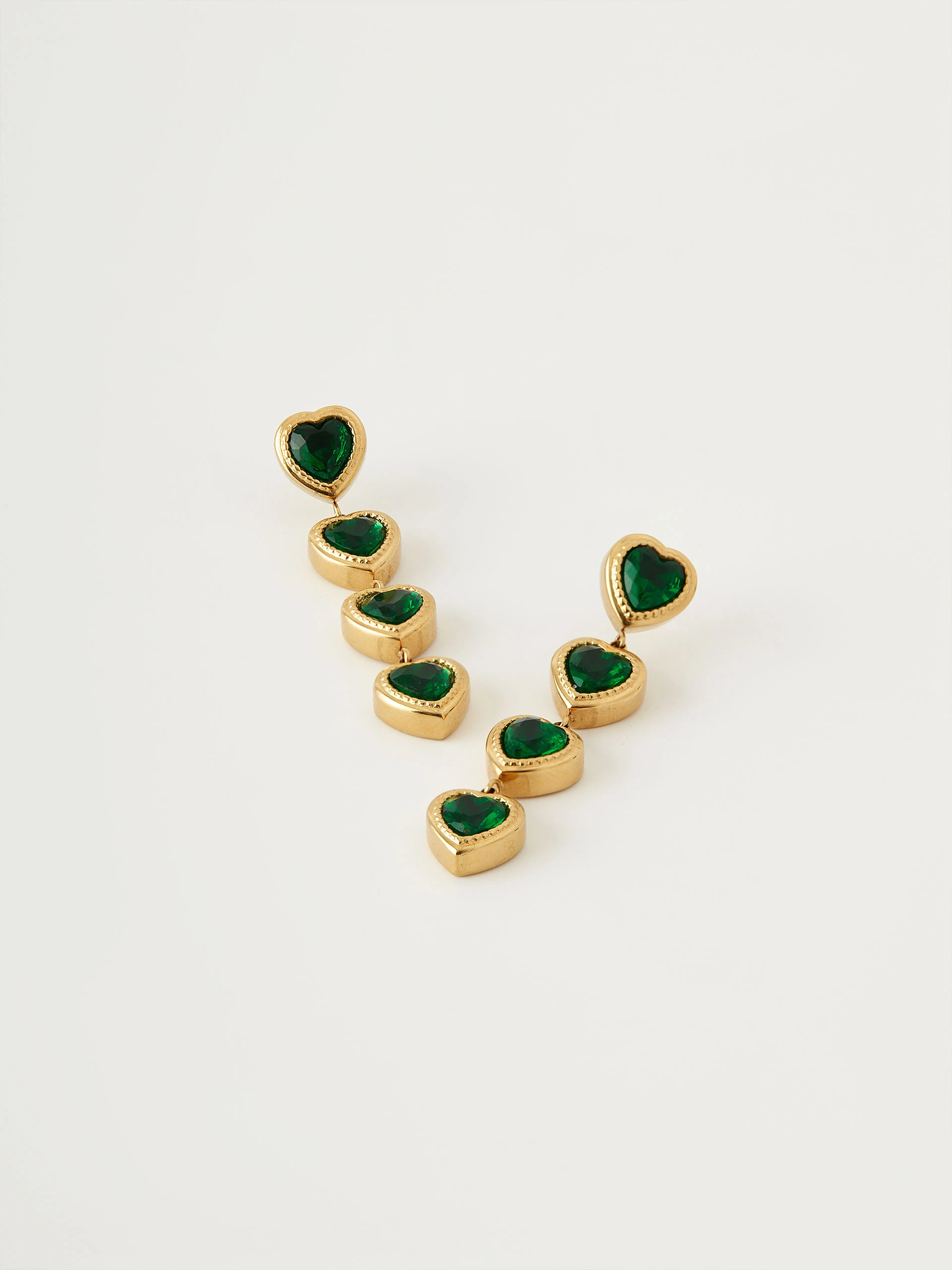 Gold-tone earrings with green hearts