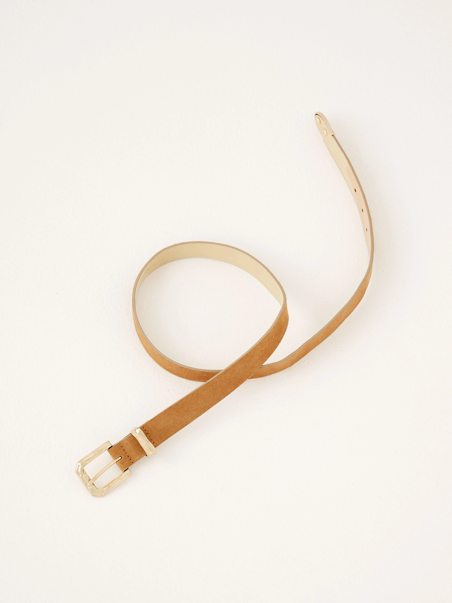 Brown leather belt with decorative buckle