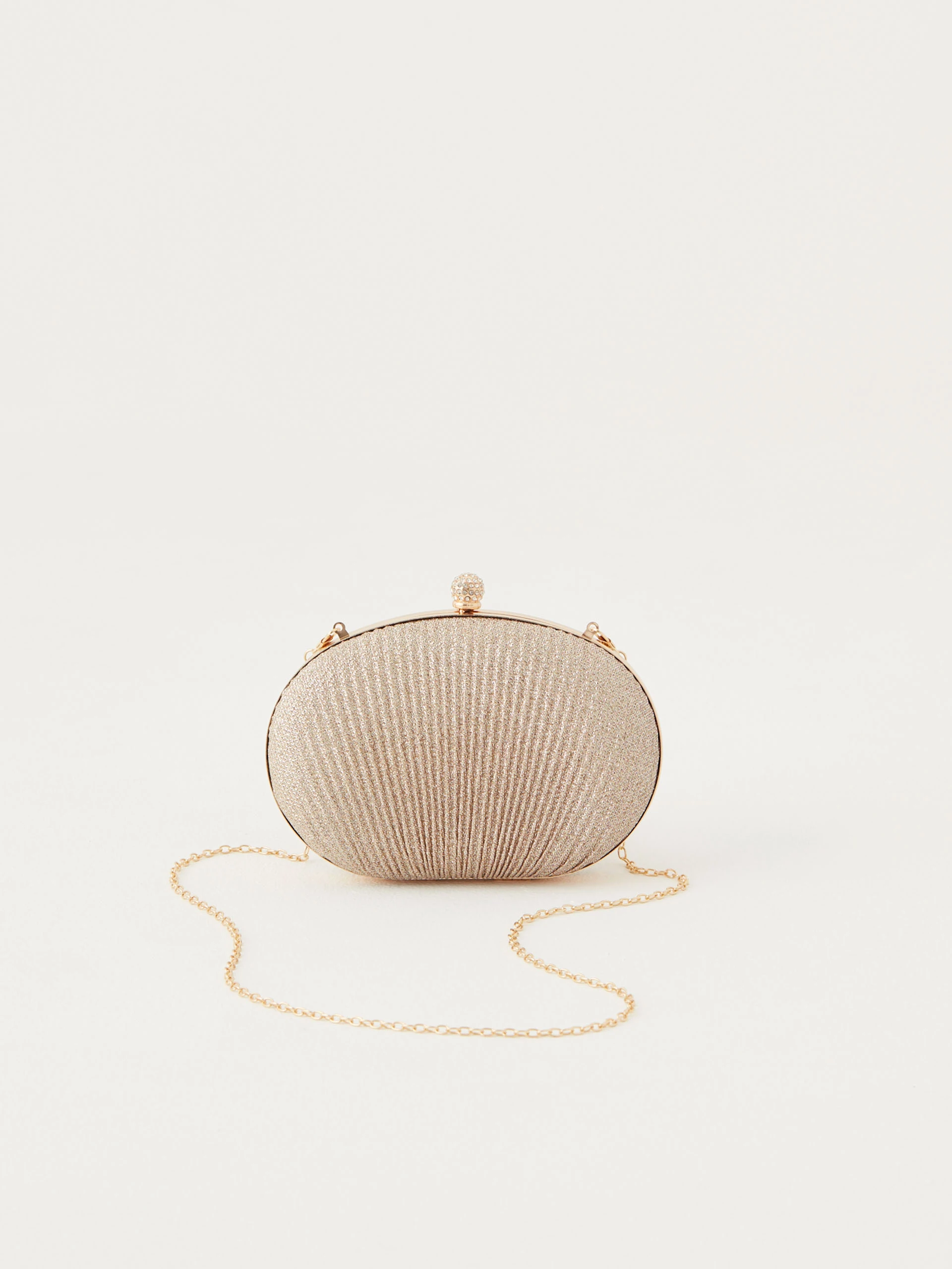 Shell-shaped bag made of shiny material
