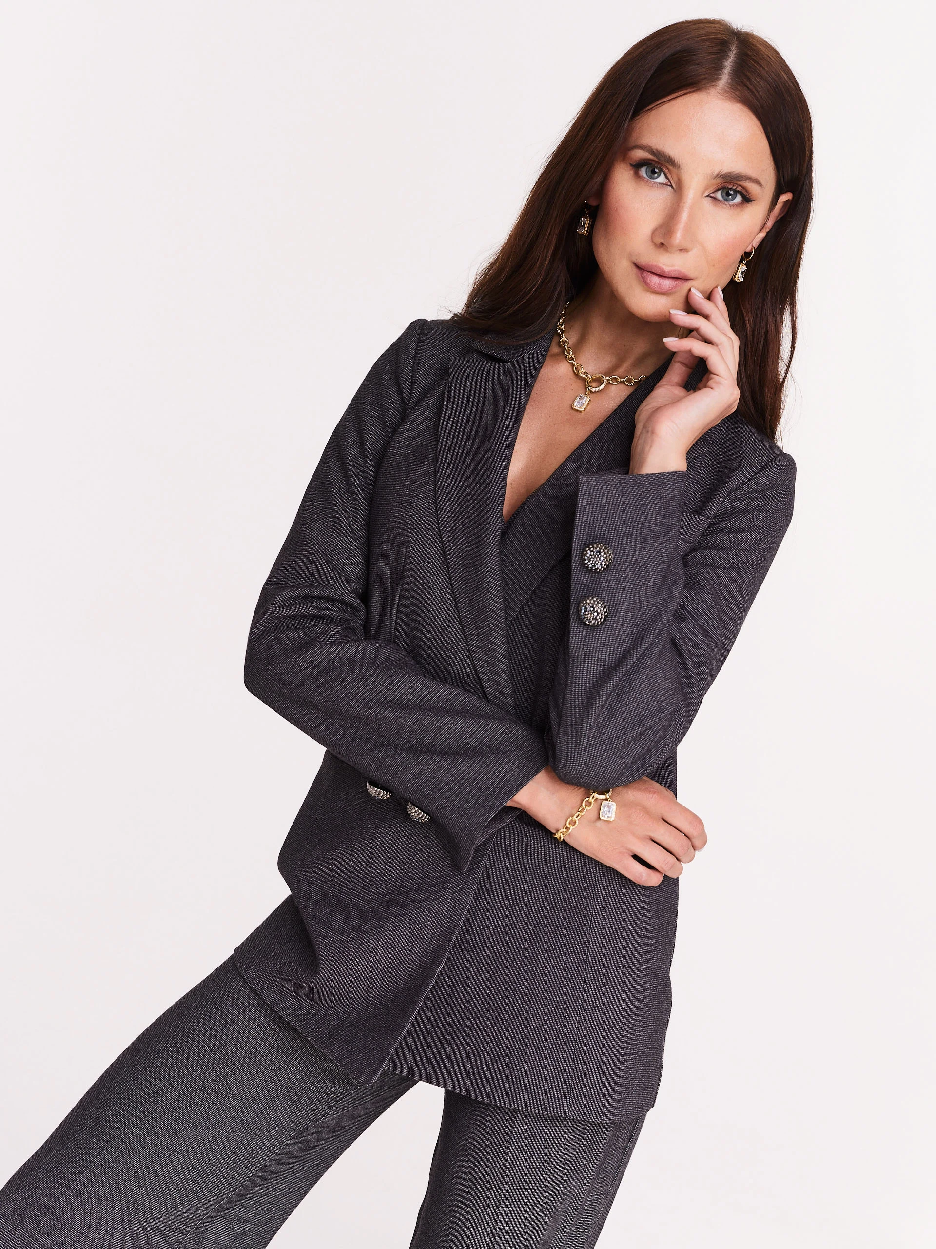 Gray jacket with jewelry brooch