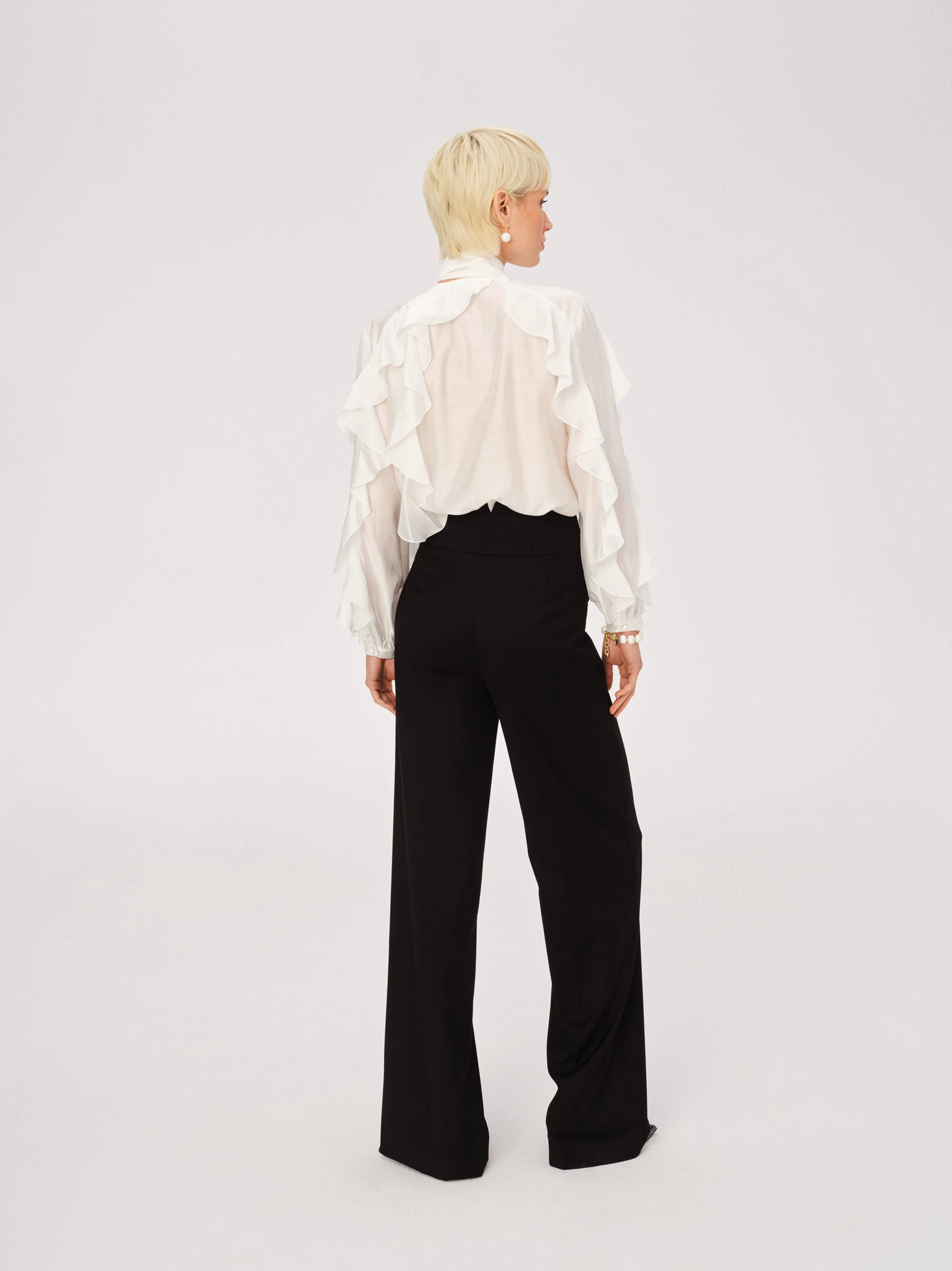 Elegant black pants with jeweled appliqué