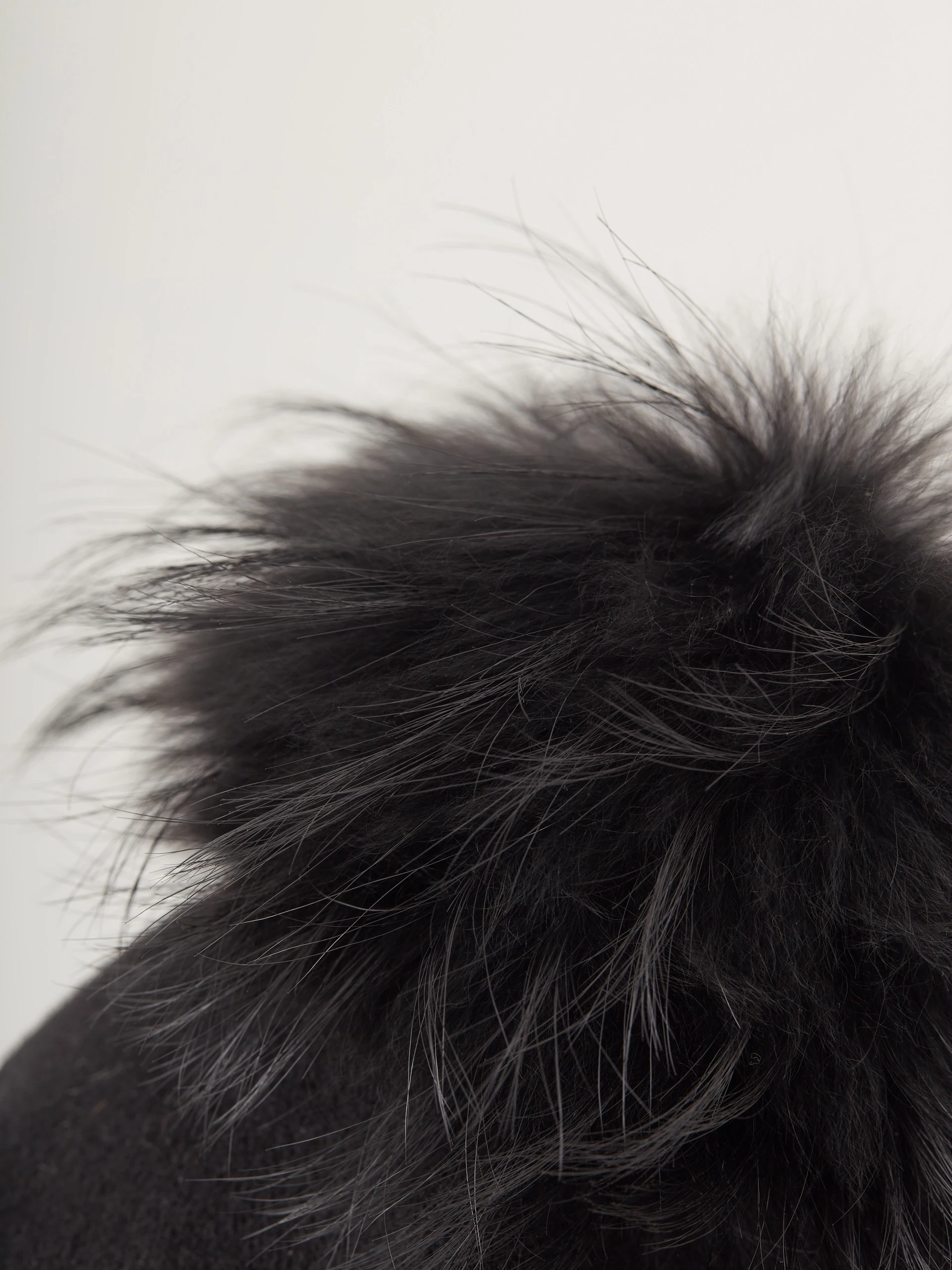 Black beret with decorative pom-pom