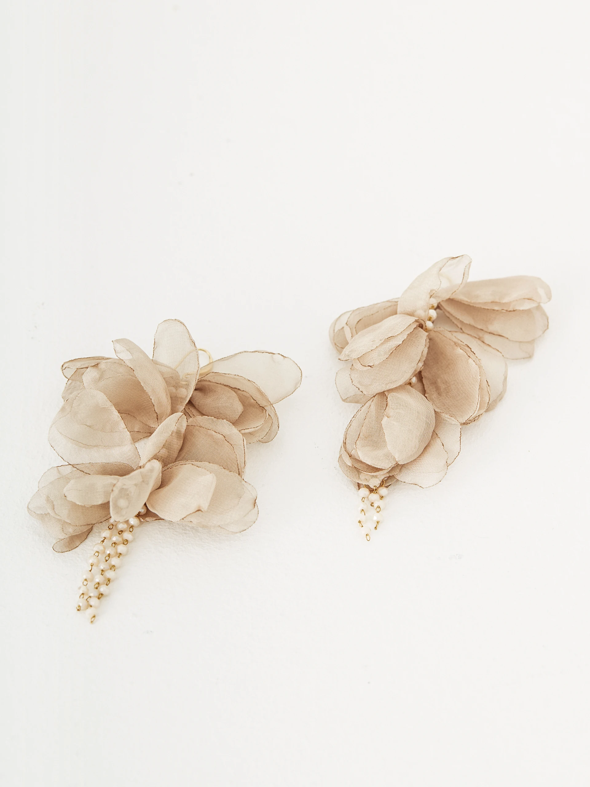 Earrings decorated with flowers and crystals