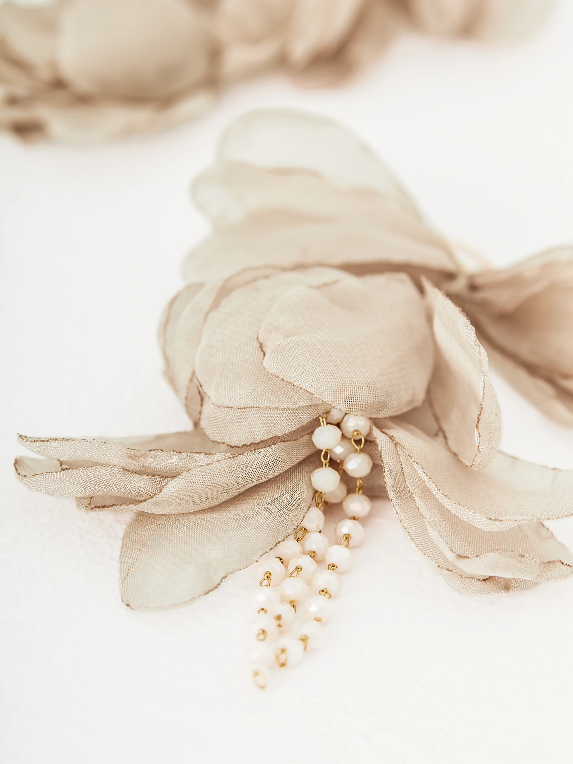 Earrings decorated with flowers and crystals