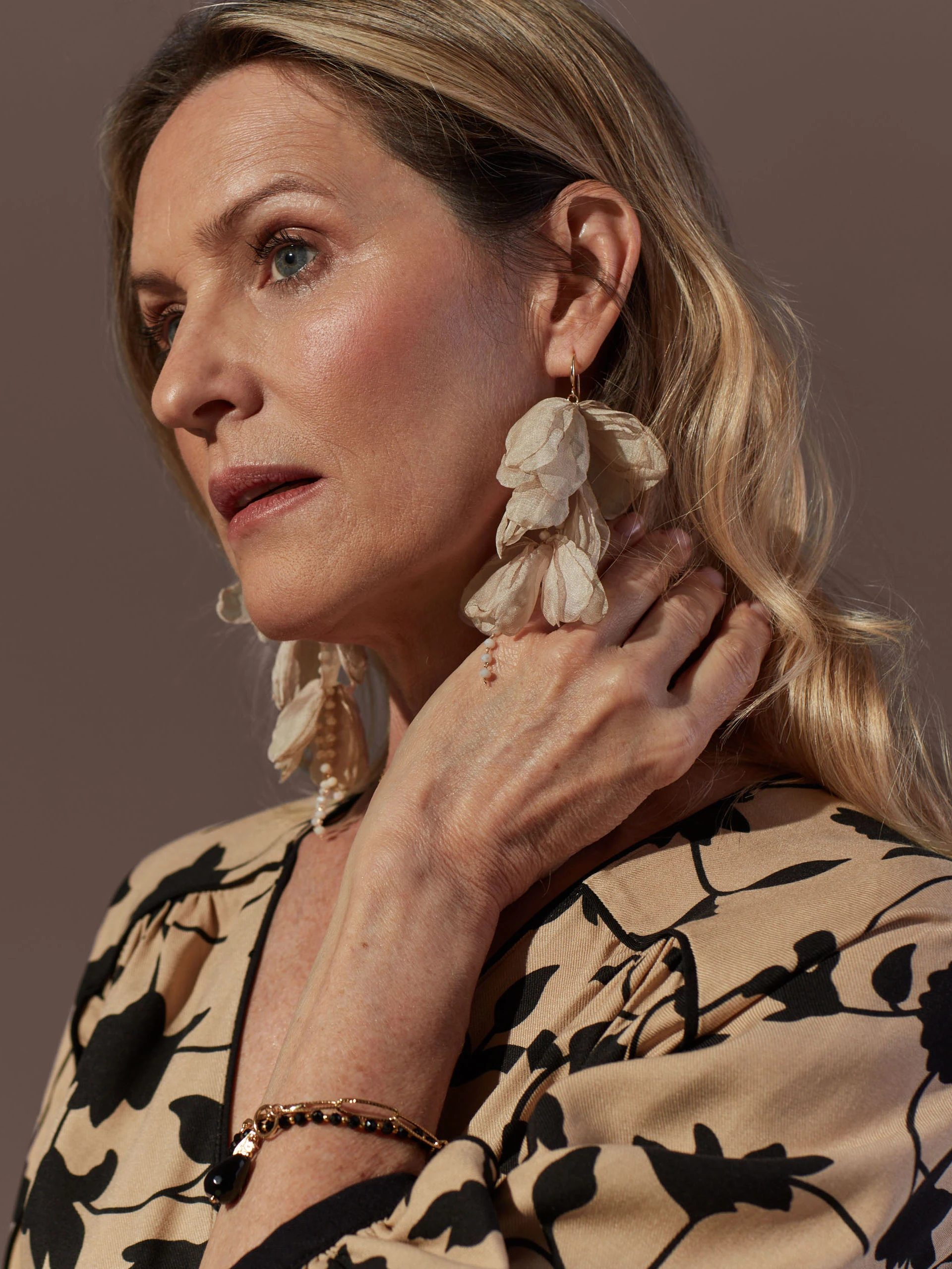Earrings decorated with flowers and crystals