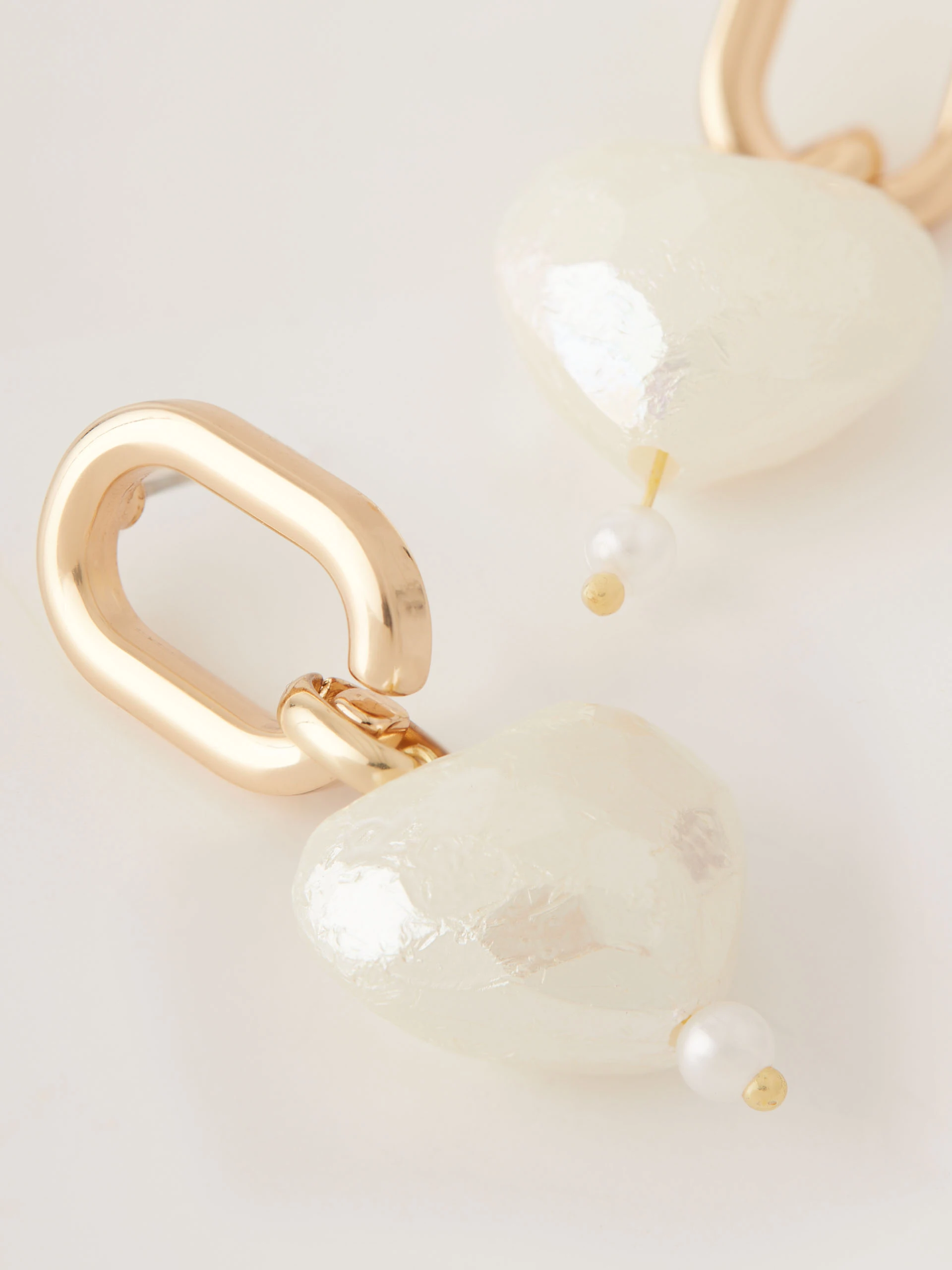 Earrings with heart-shaped pendants