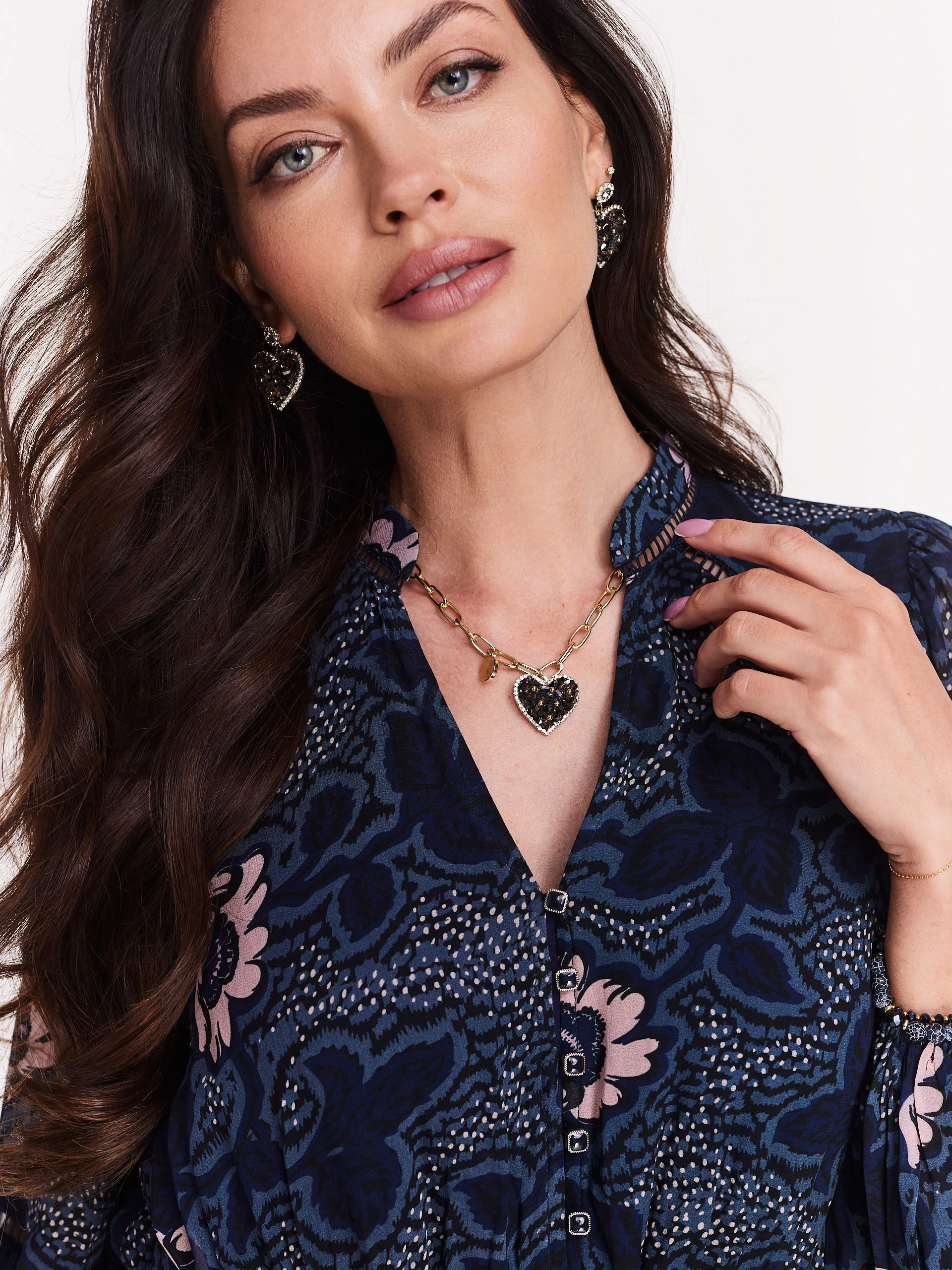 Gold-colored chain with heart-shaped pendant
