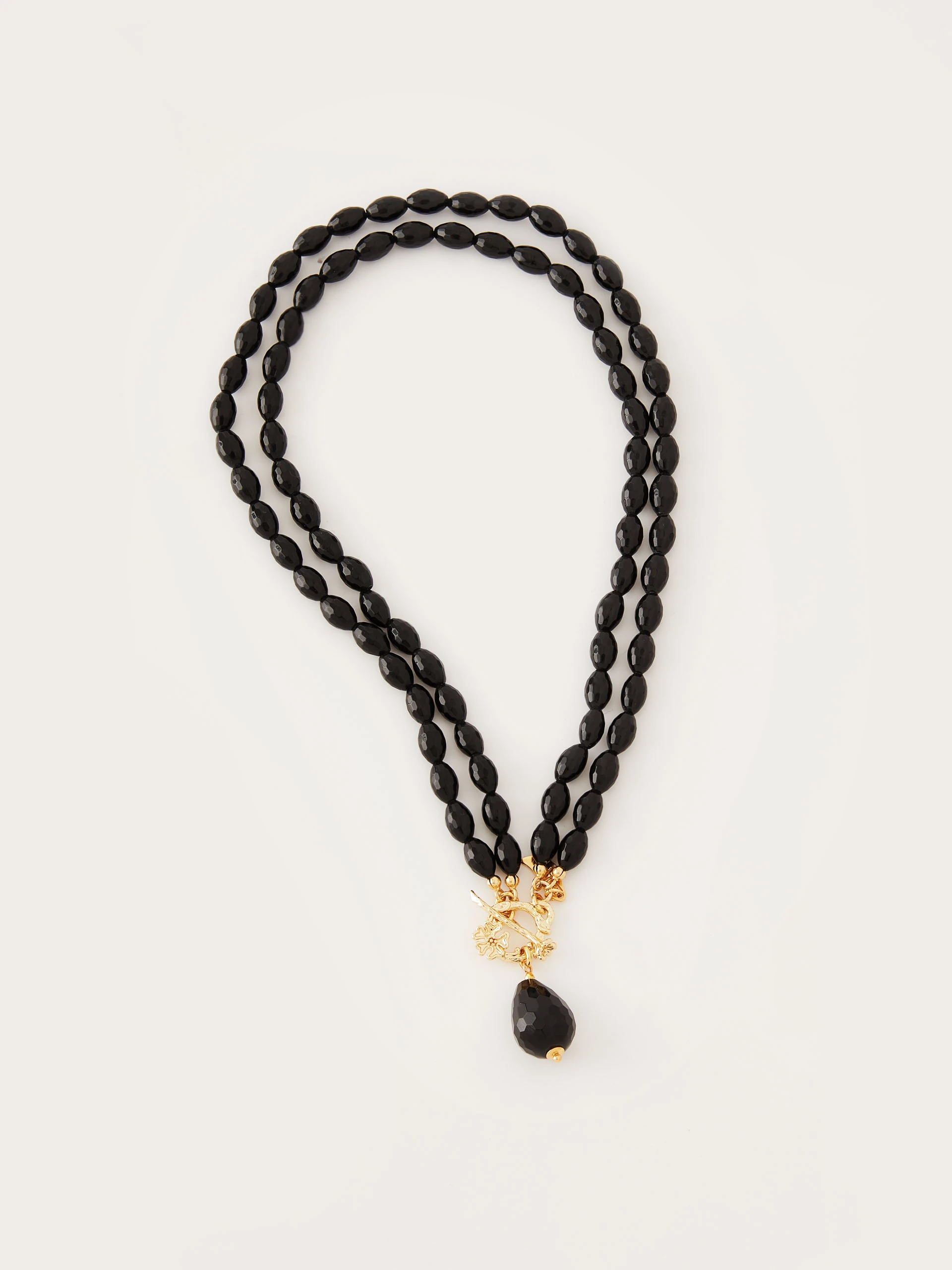 Gold plated necklace decorated with onyxes