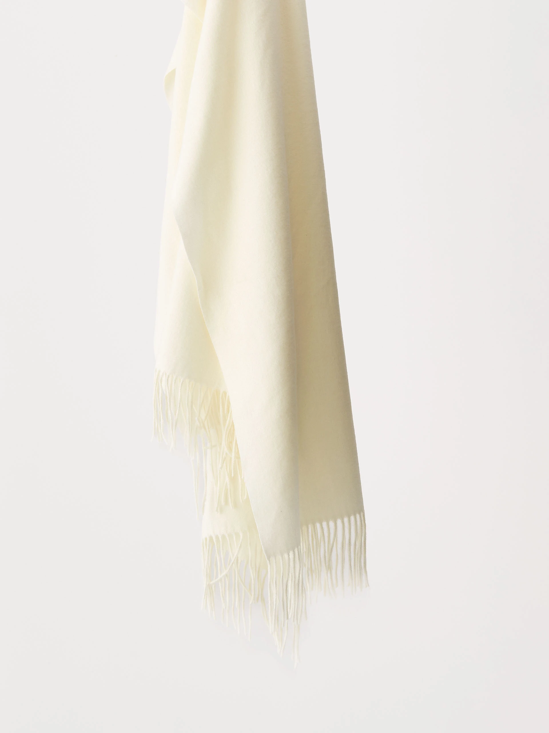 Cream knitted shawl with tassels