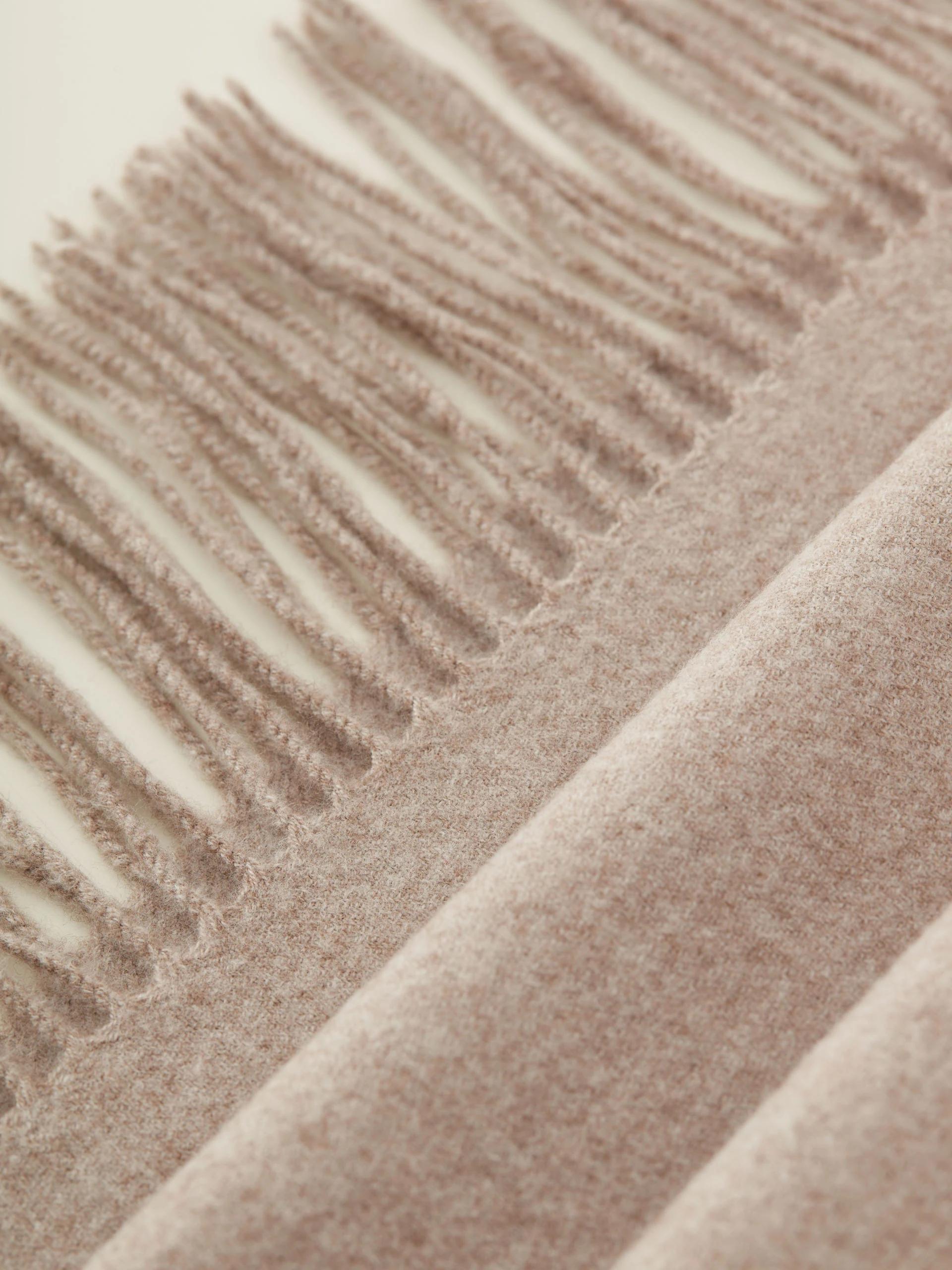 Elegant light brown shawl with tassels at the ends