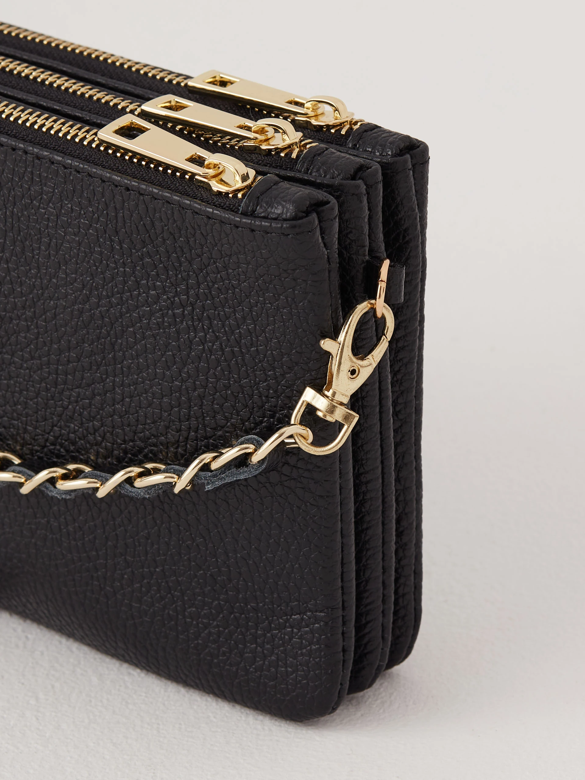 Black leather handbag on a long strap