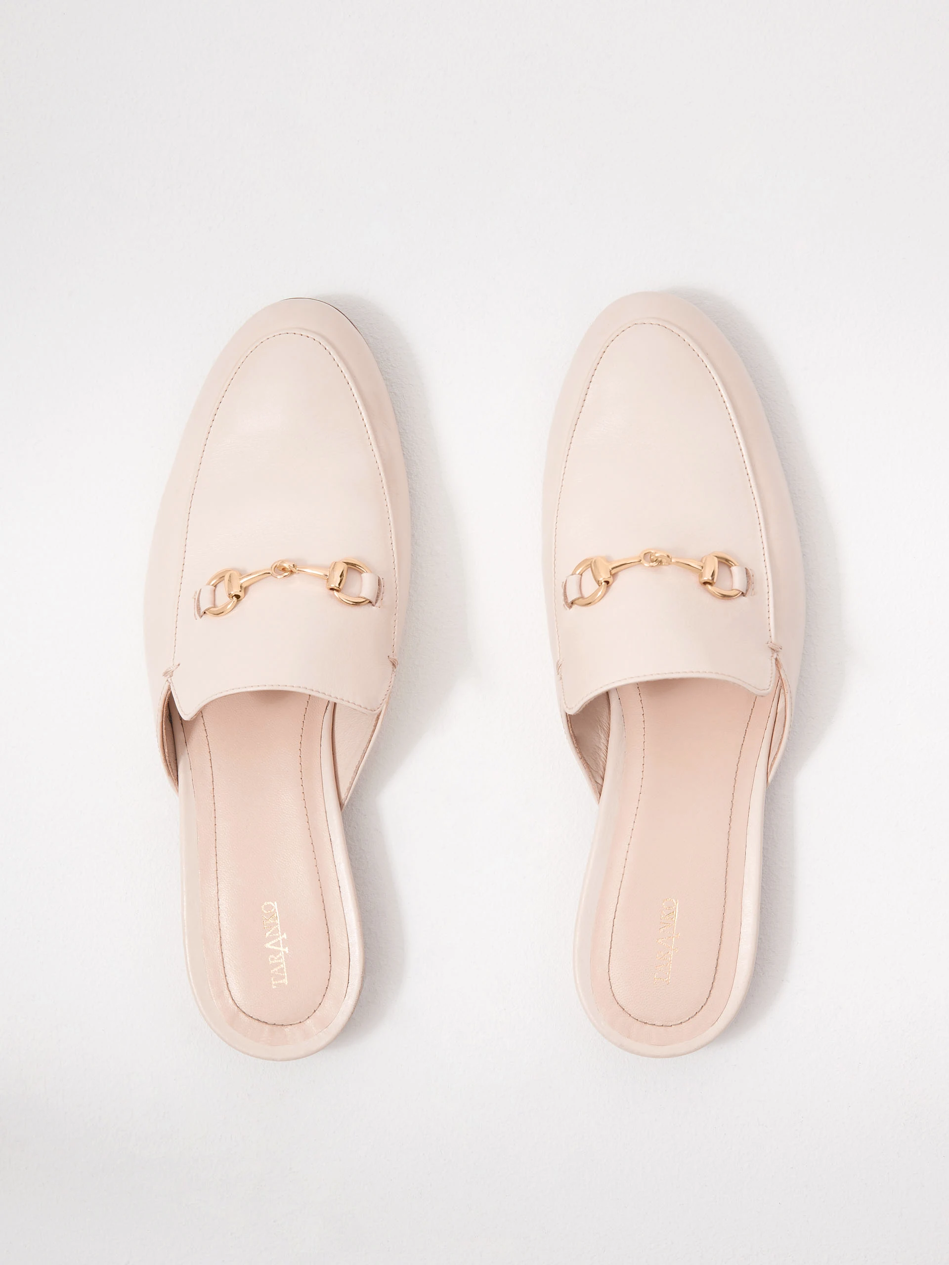 Beige leather moccasin-style flip-flops