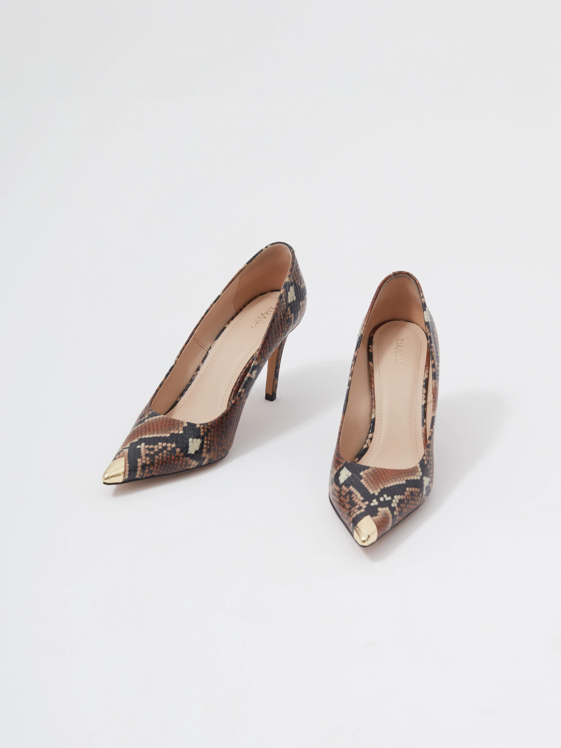 Leather pumps with animal skin motif