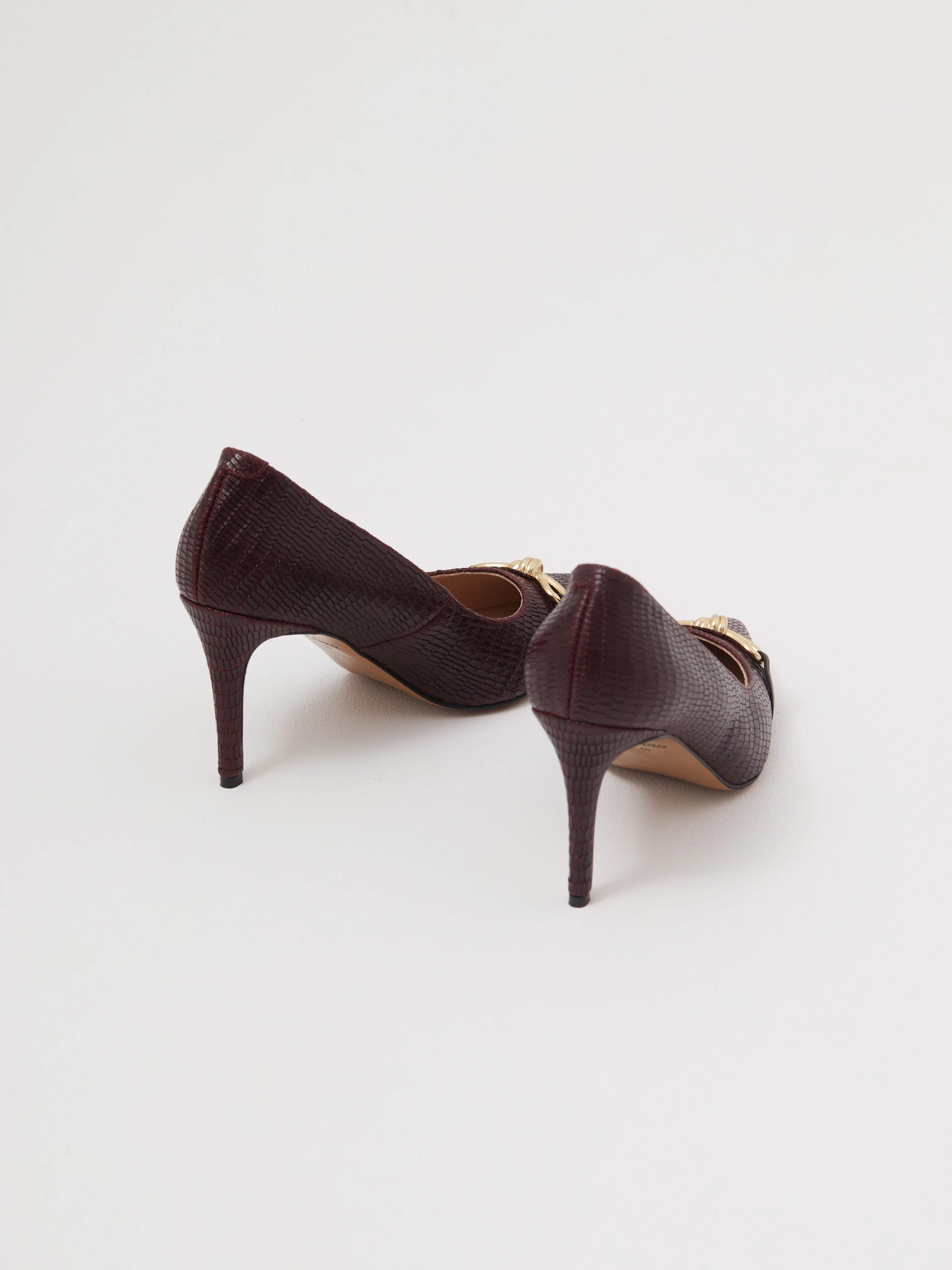 Burgundy leather pumps with decorative bows