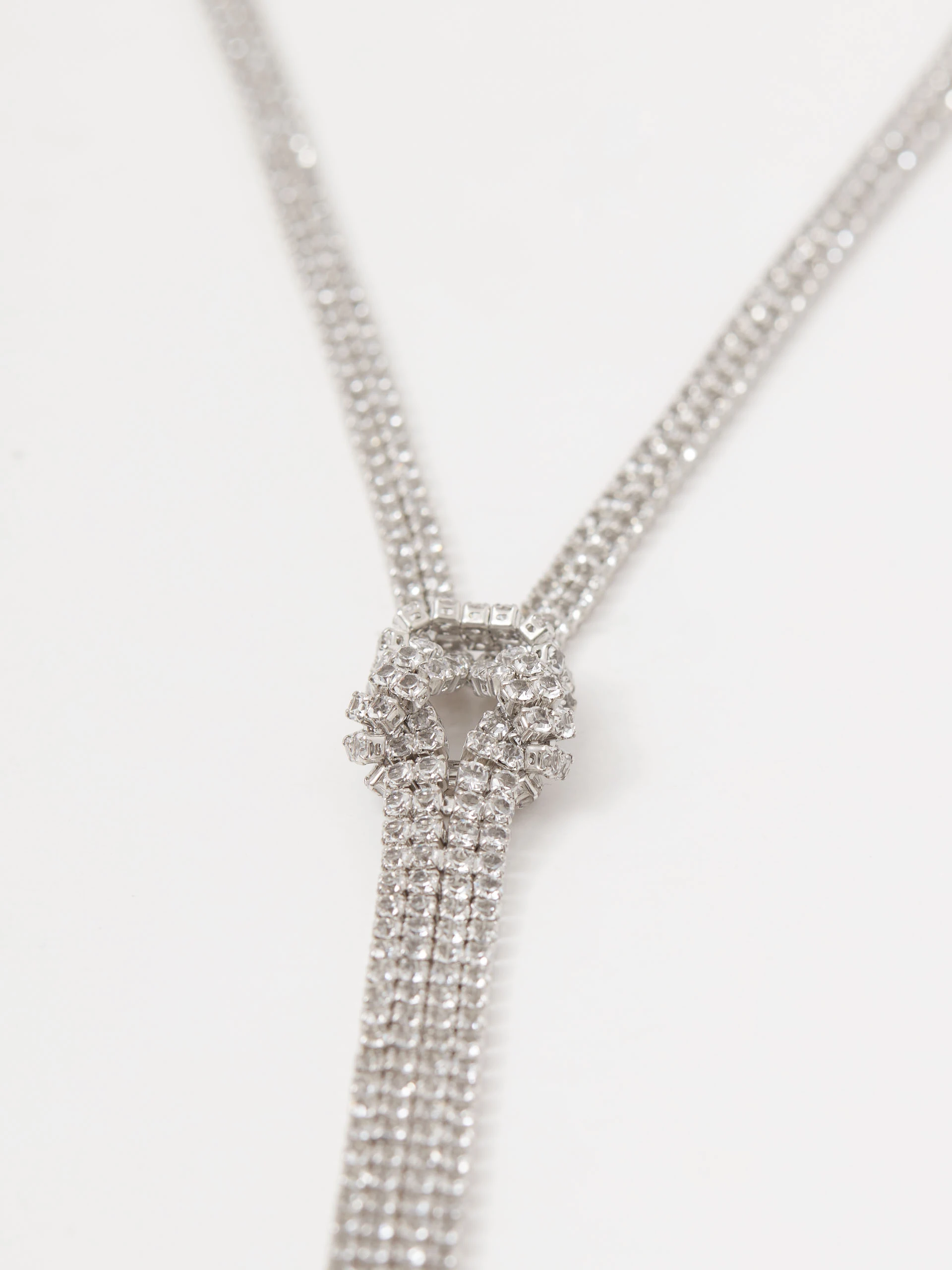 Necklace in the form of a tie with a decorative knot