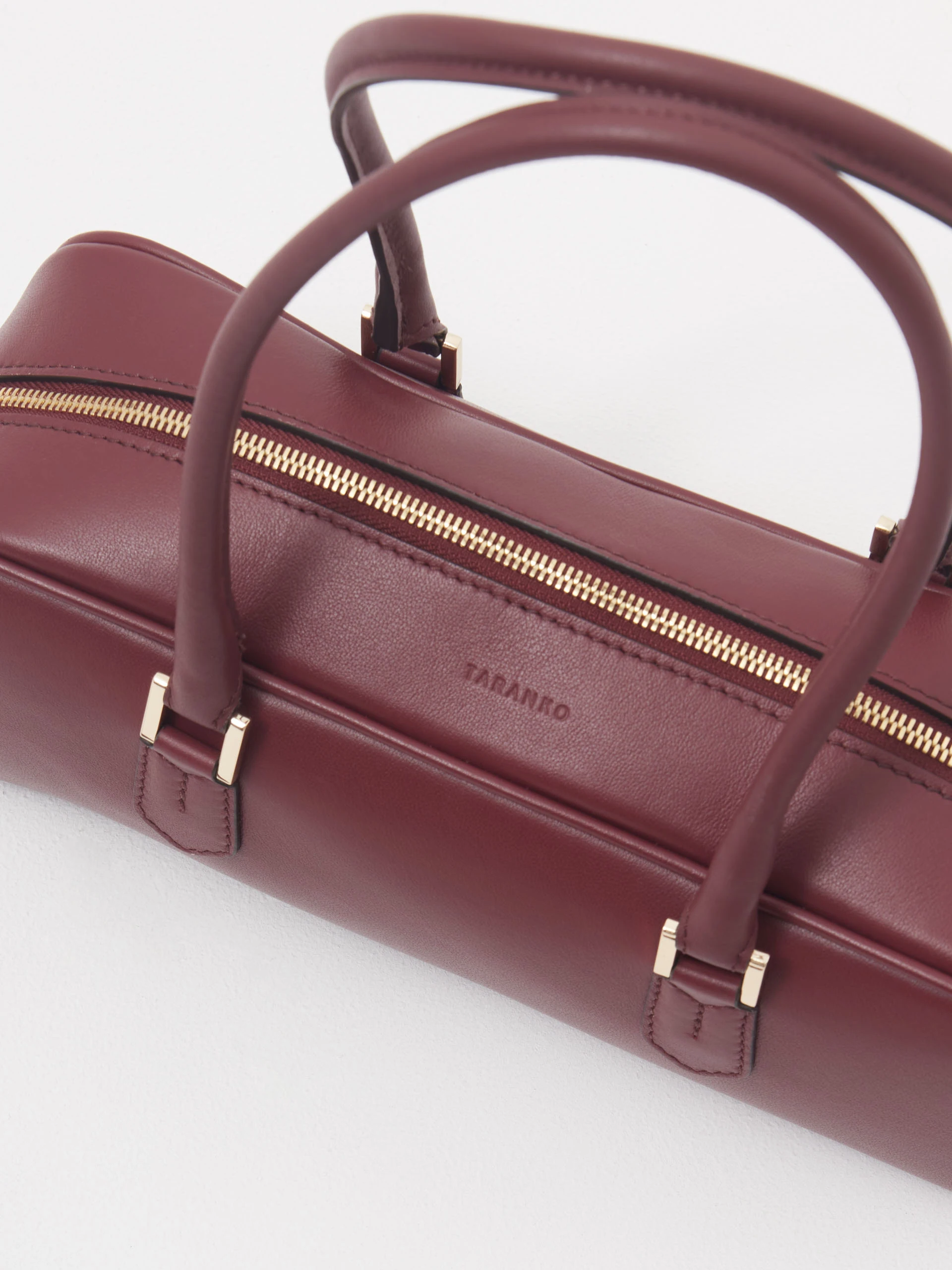Burgundy leather baguette bag