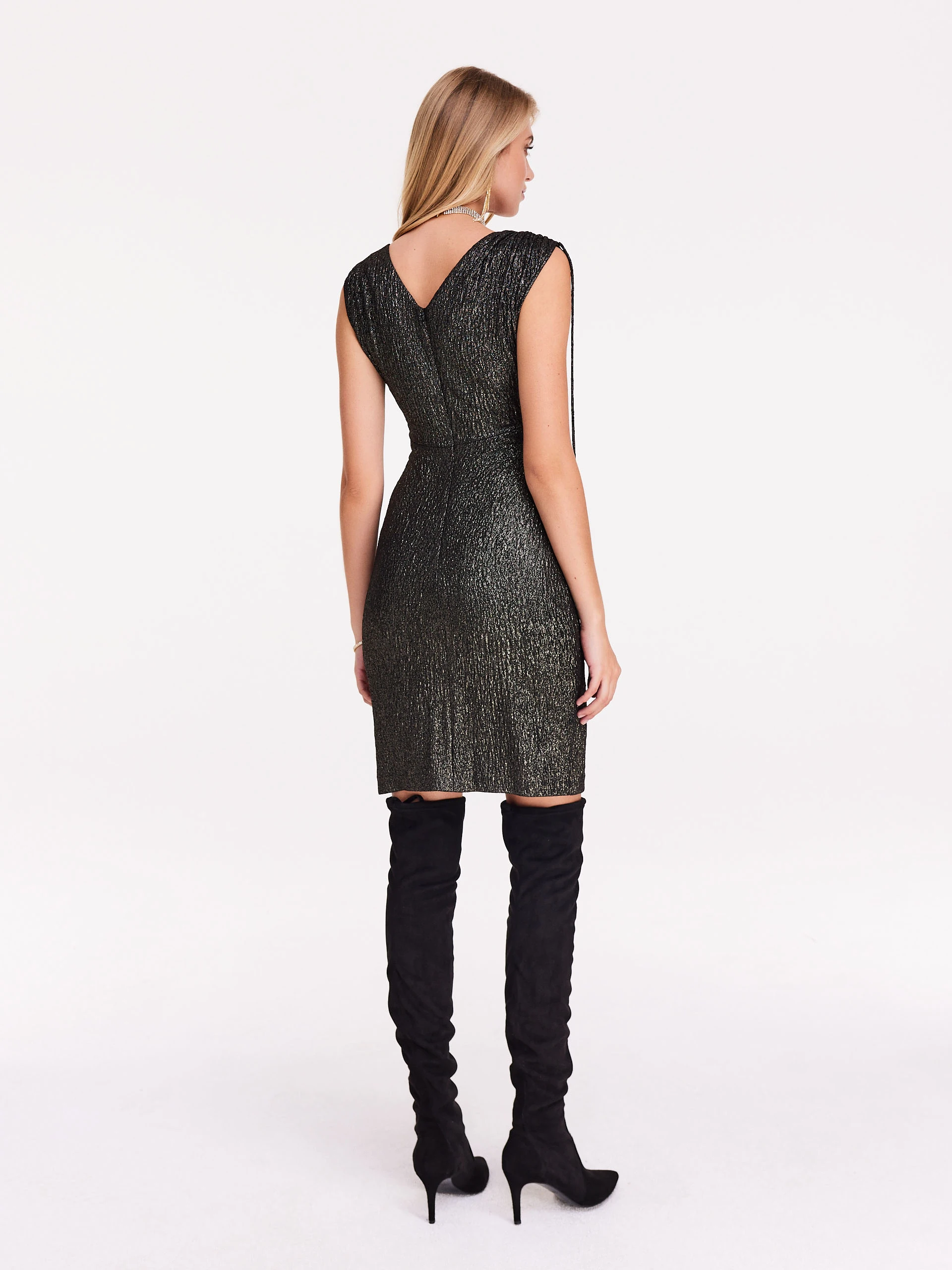 Fitted black and gold dress with shimmering trim