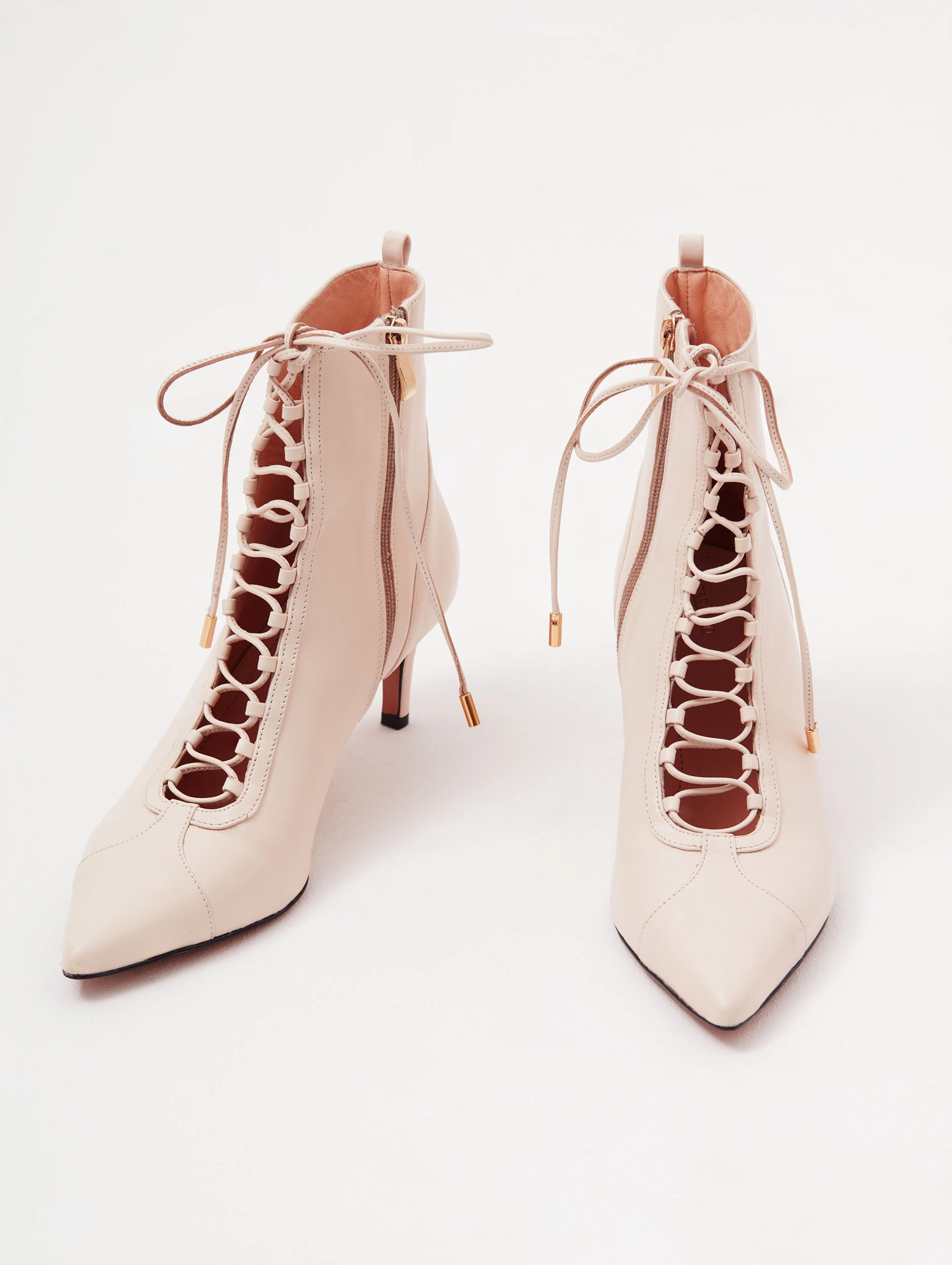 Beige heeled ankle boots made of genuine leather