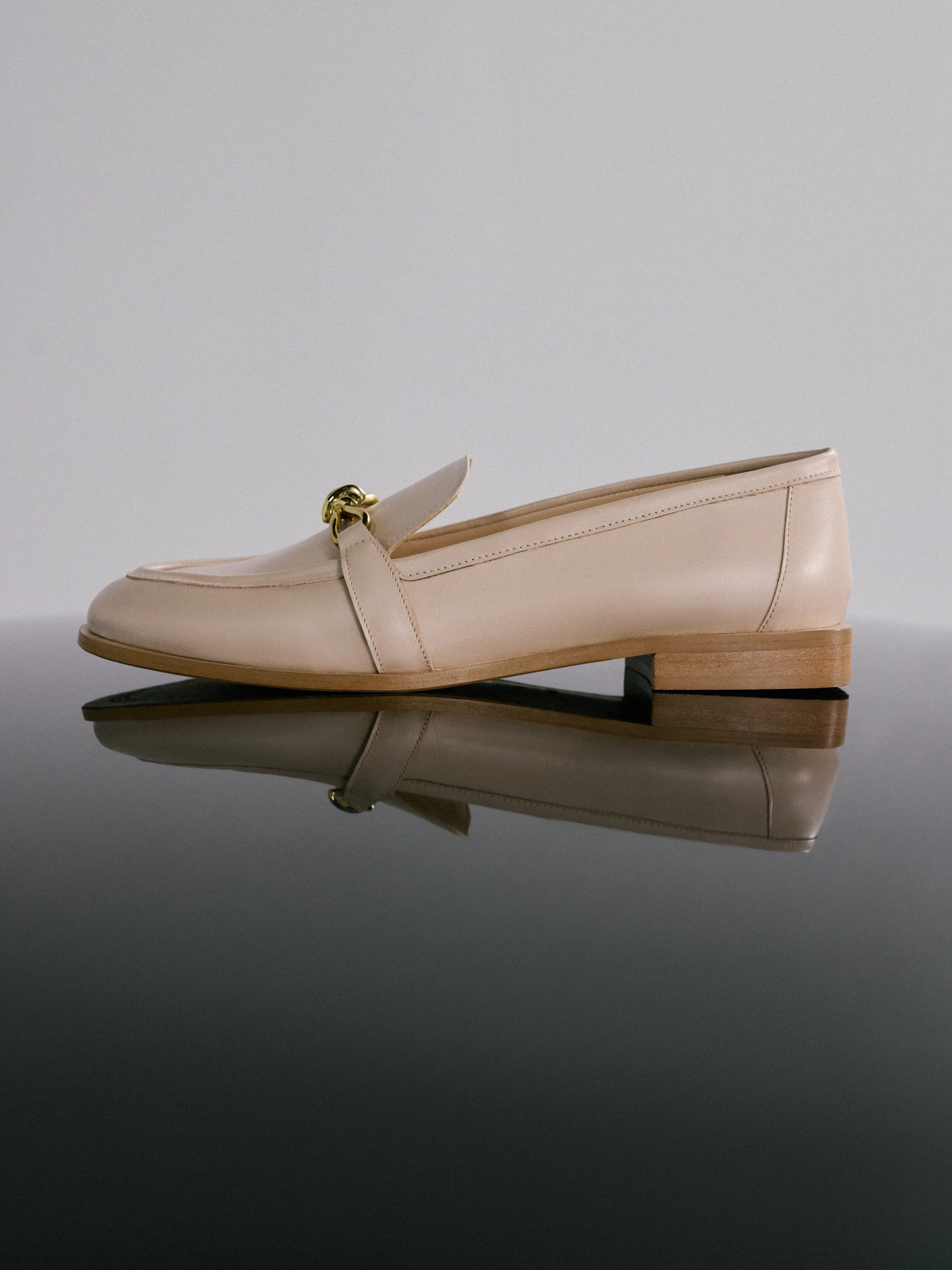 Beige leather moccasins with buckles