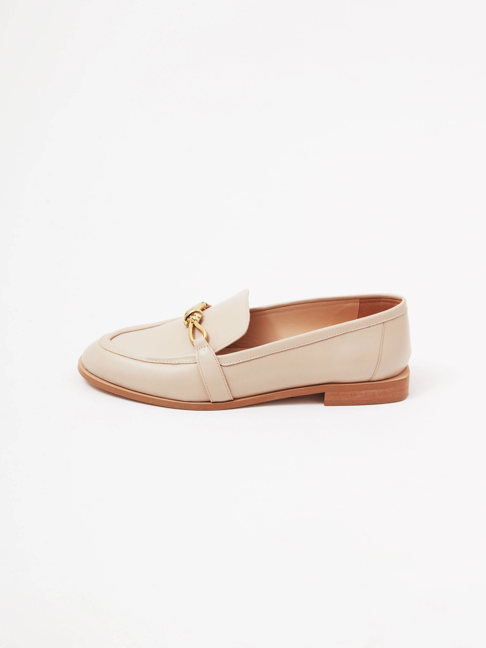 Beige leather moccasins with buckles