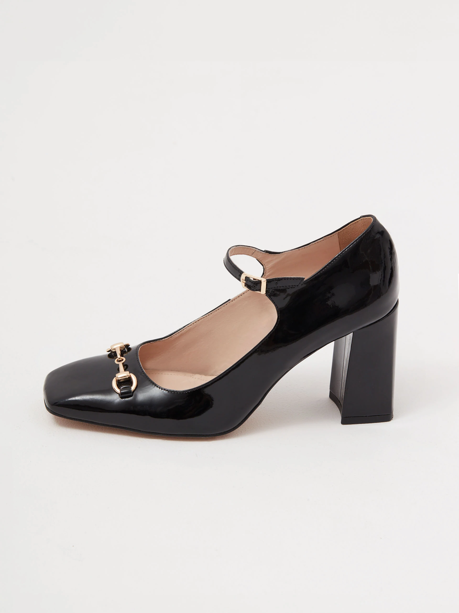 Black leather pumps with decorative buckles