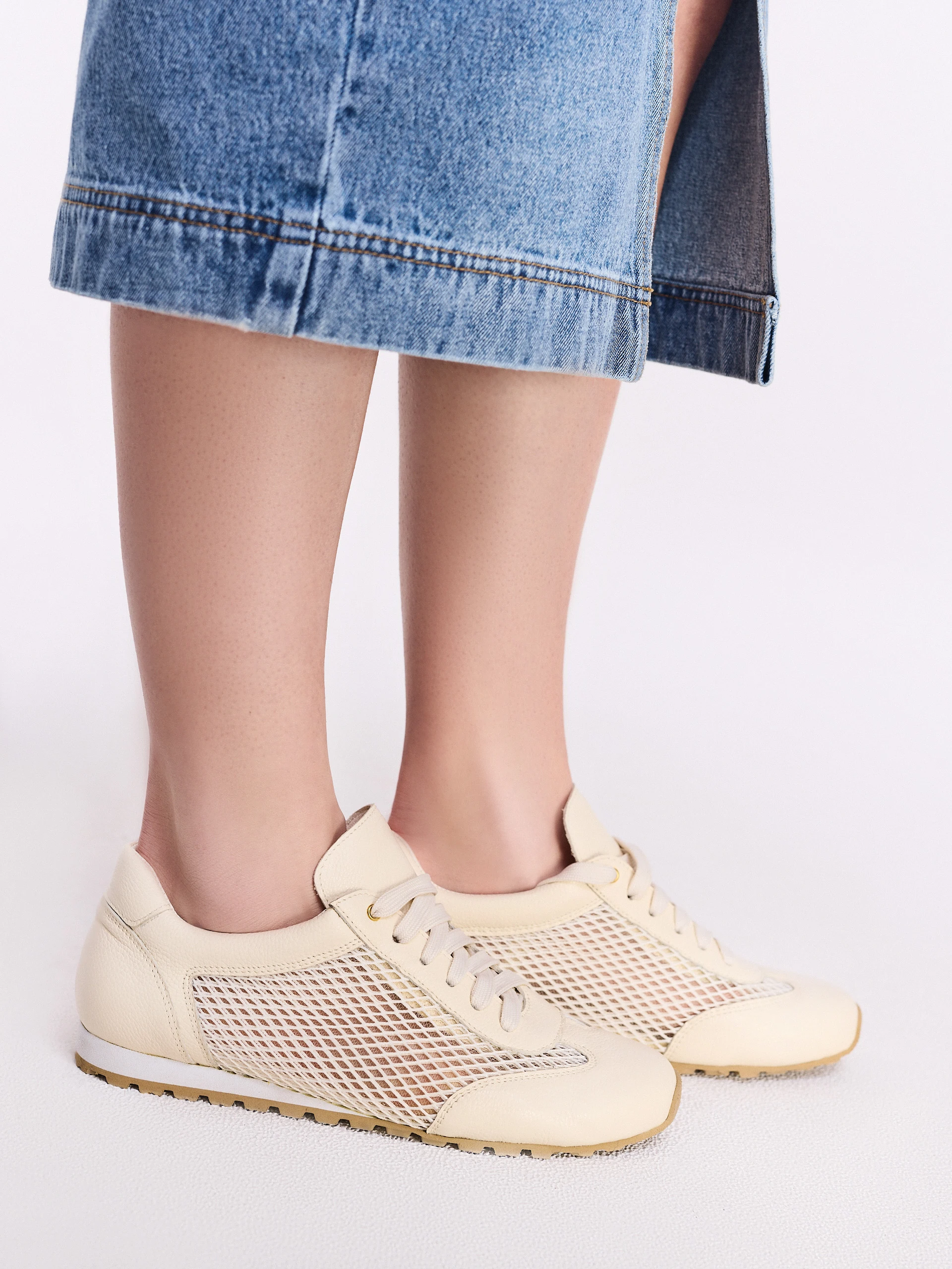 Leather cream sneakers with decorative tags