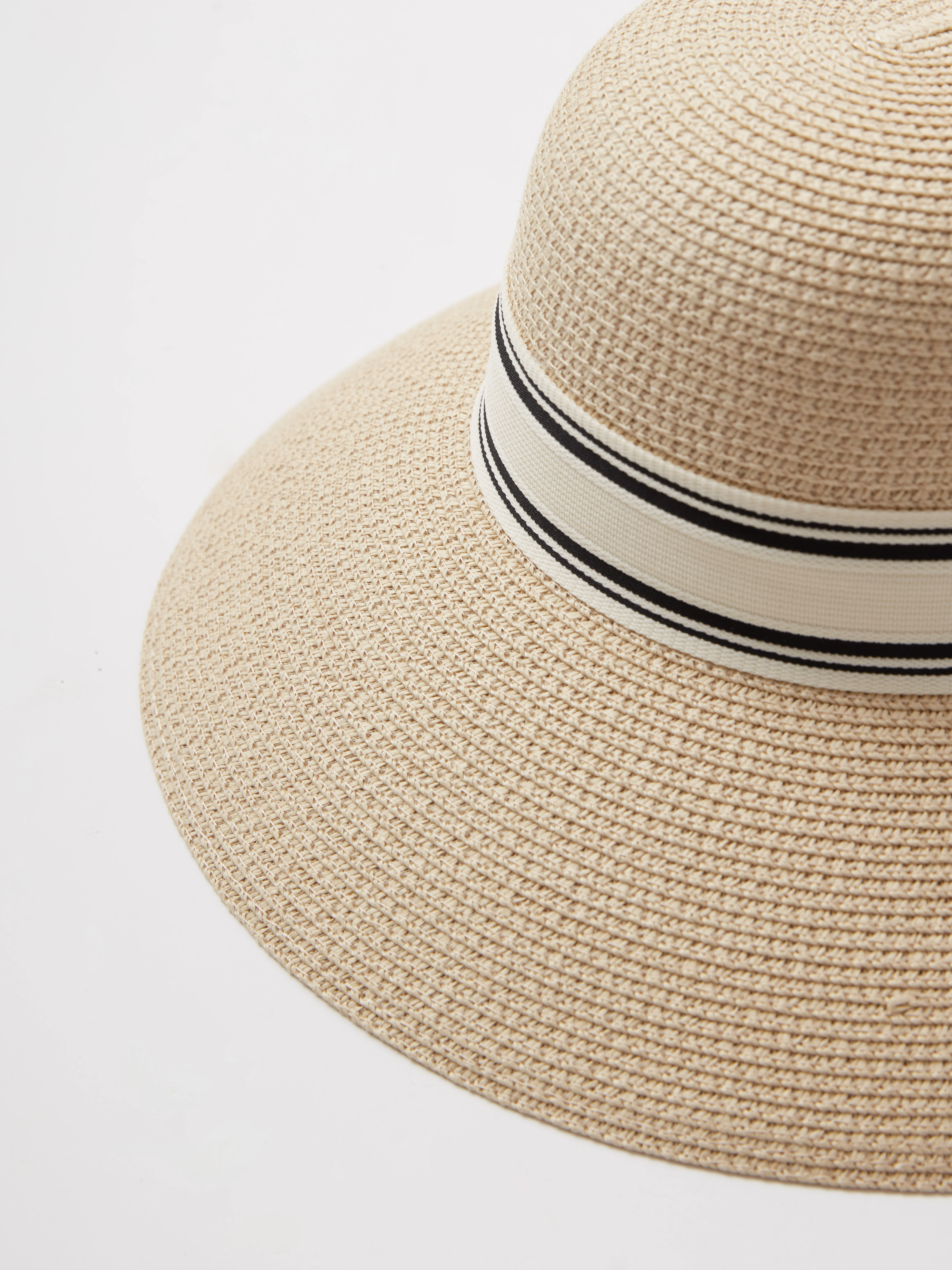 A large hat with a decorative ribbon