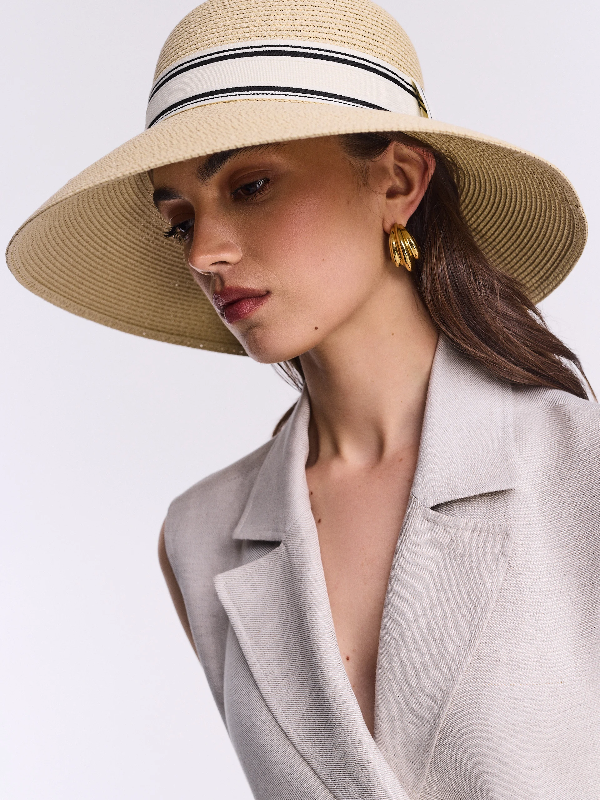 A large hat with a decorative ribbon