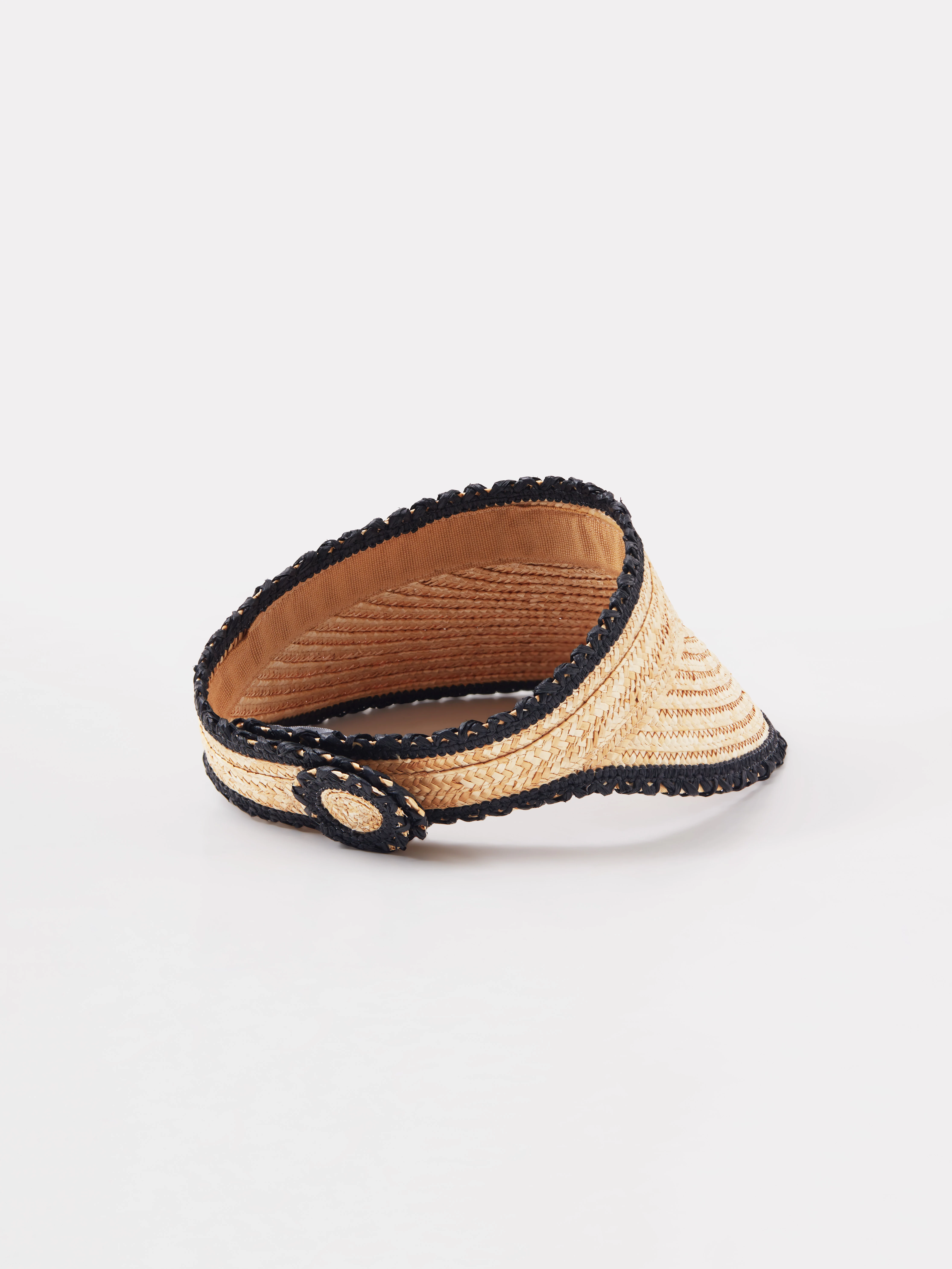 A visor made of natural fibers with decorative trim