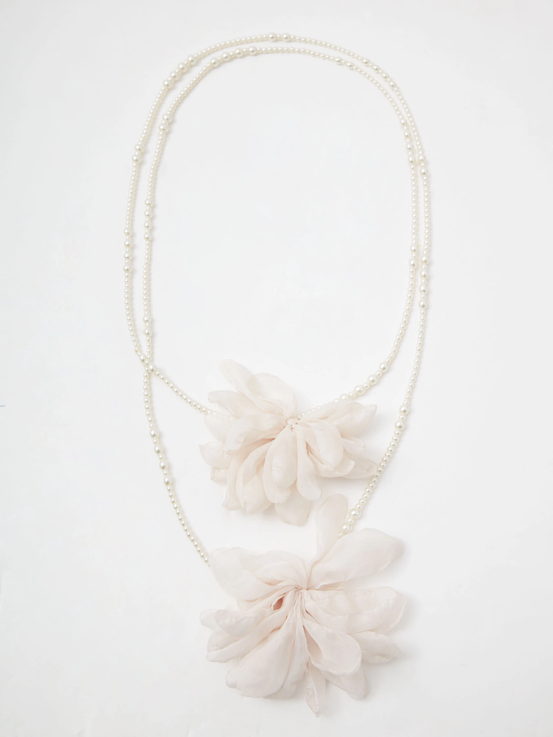 Double necklace made of glass pearls with flowers