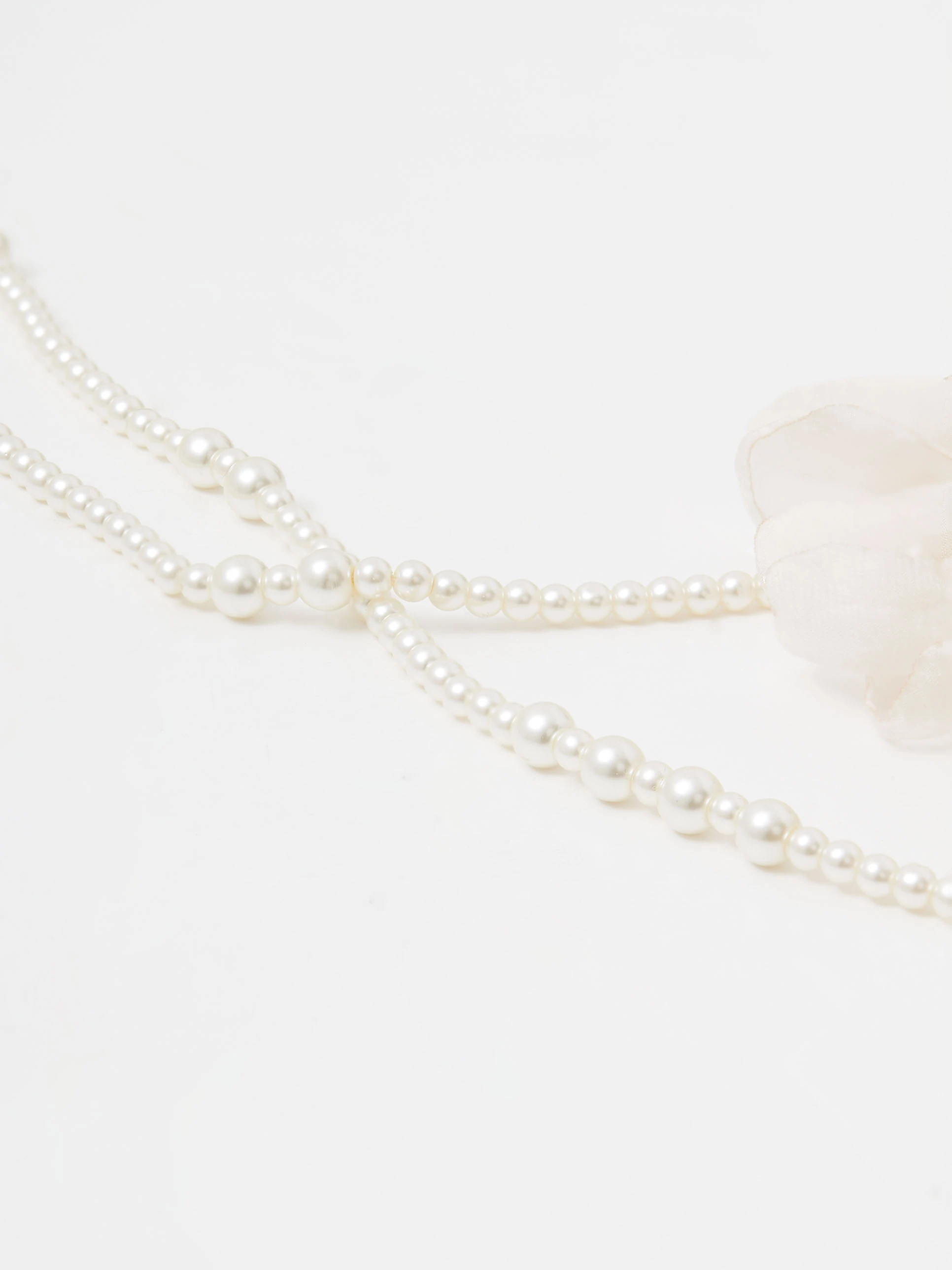 Double necklace made of glass pearls with flowers