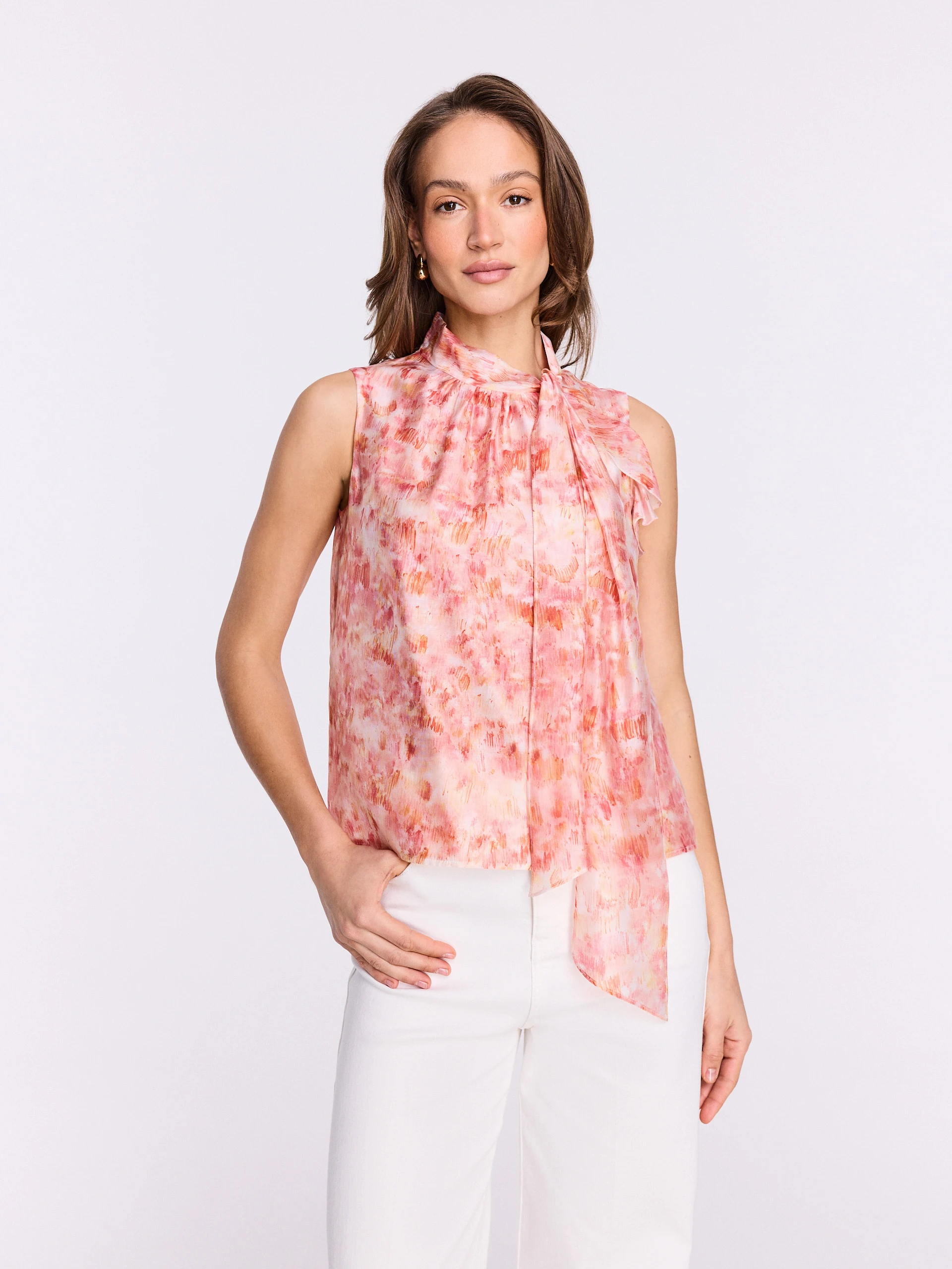 Pink blouse with a colorful patterned sash