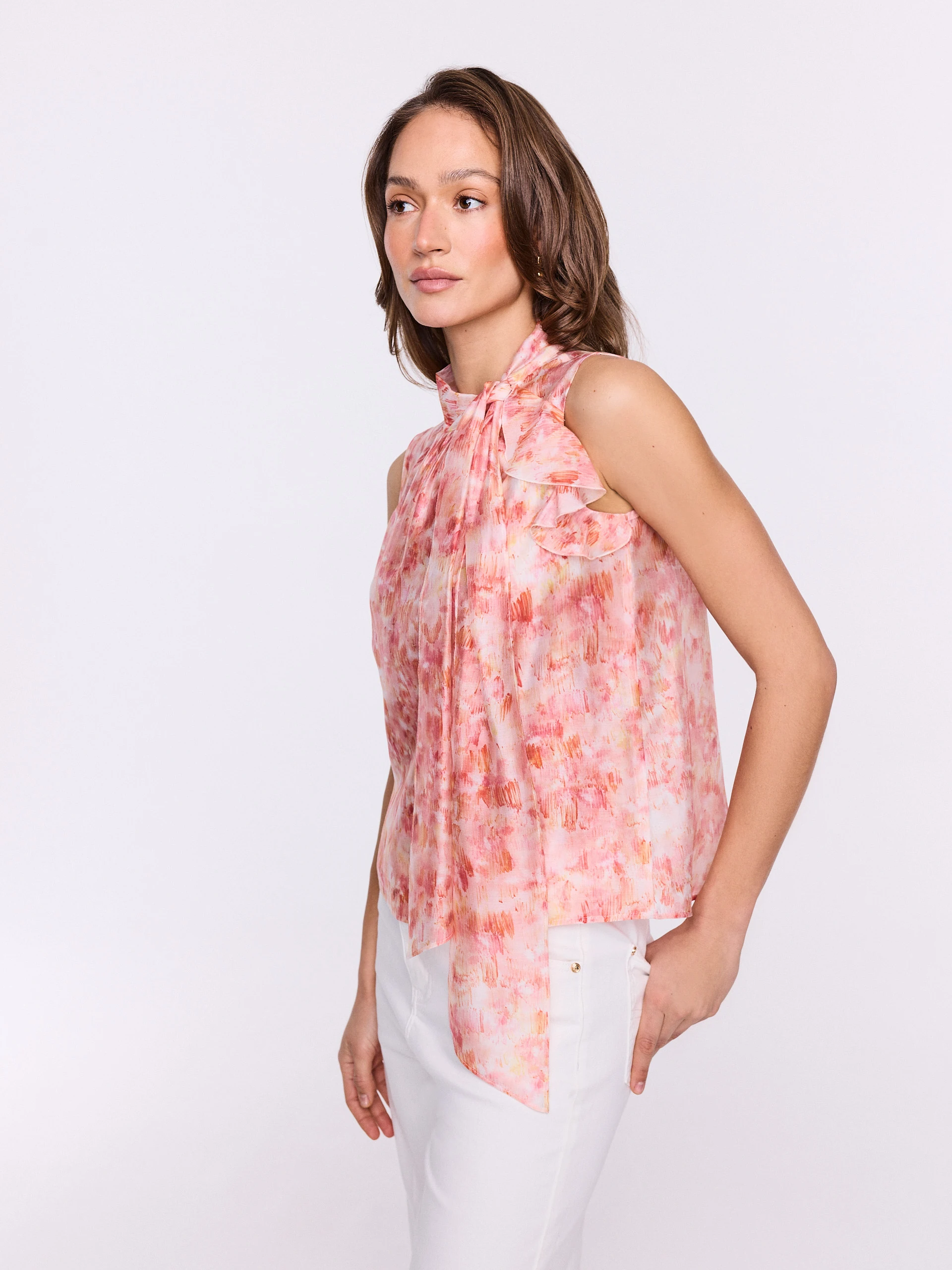 Pink blouse with a colorful patterned sash