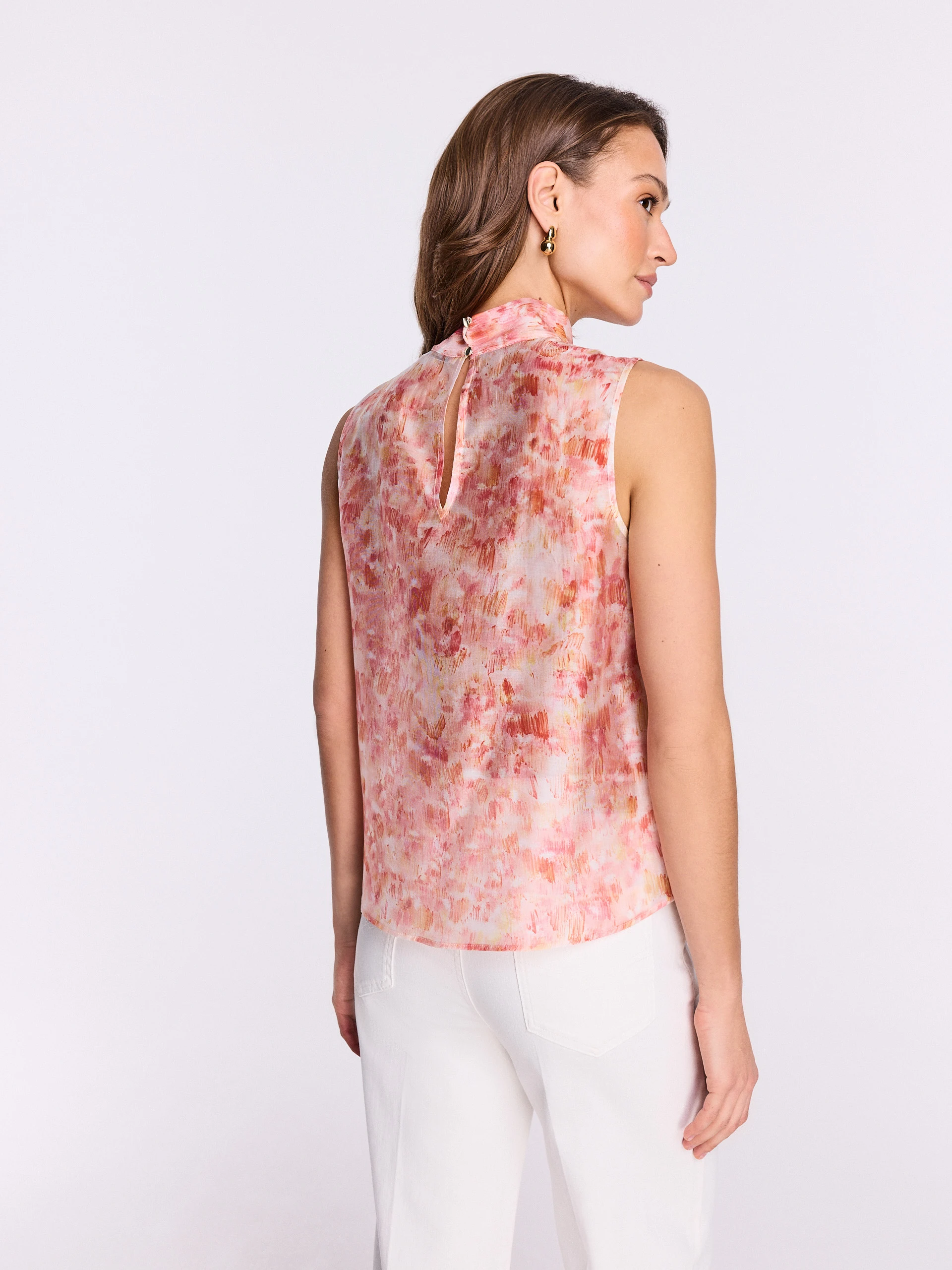 Pink blouse with a colorful patterned sash