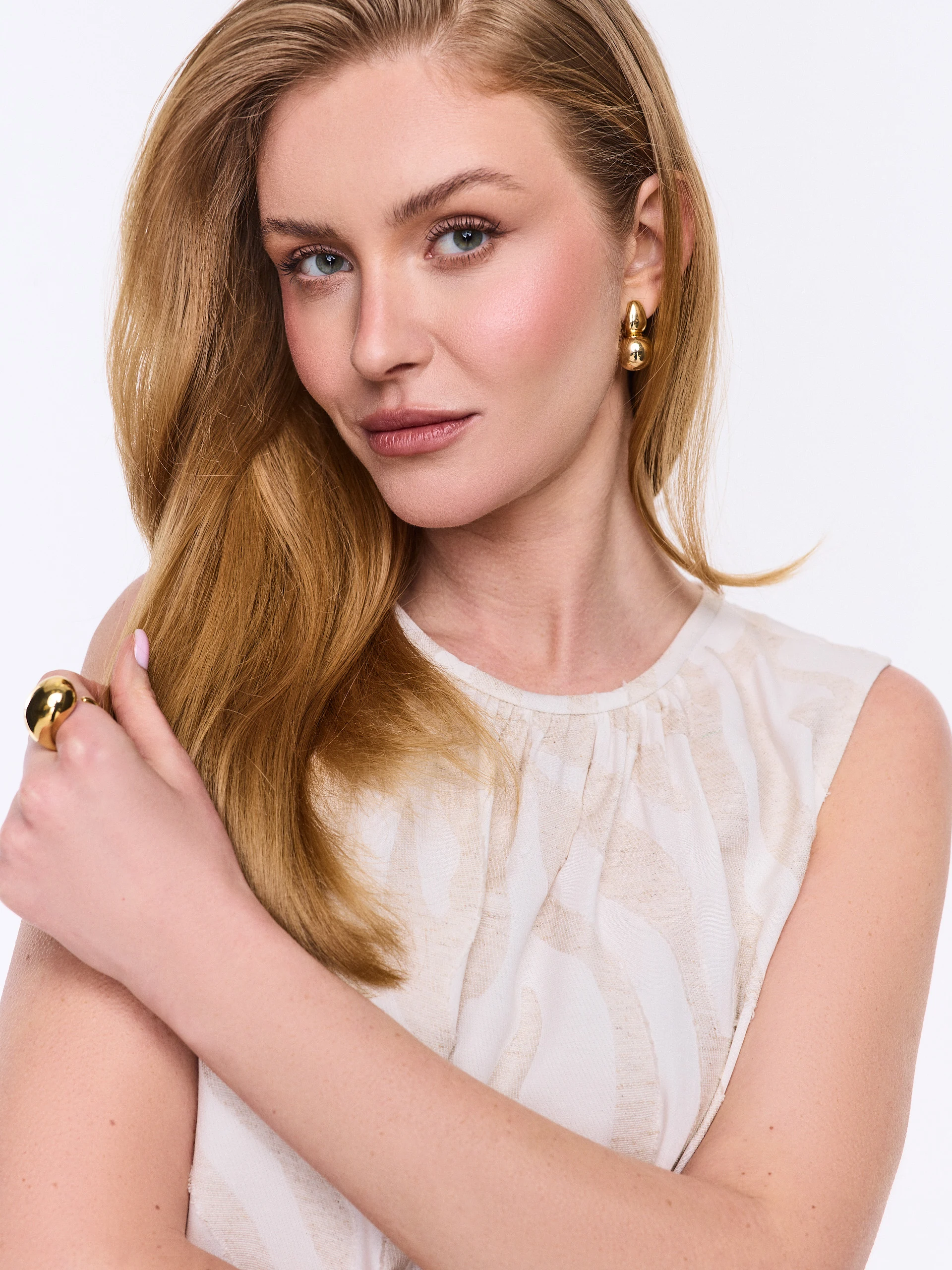 A light-colored blouse with an animal print and linen accents