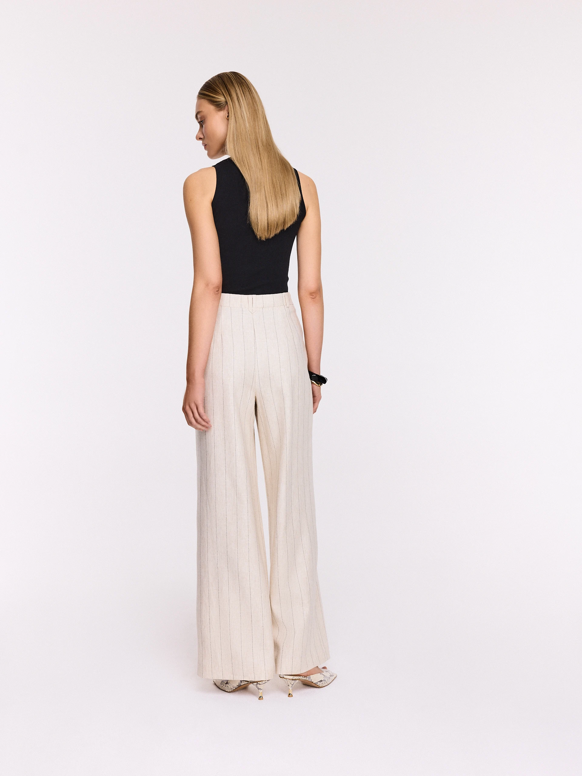 Light beige high-waisted ribbed trousers